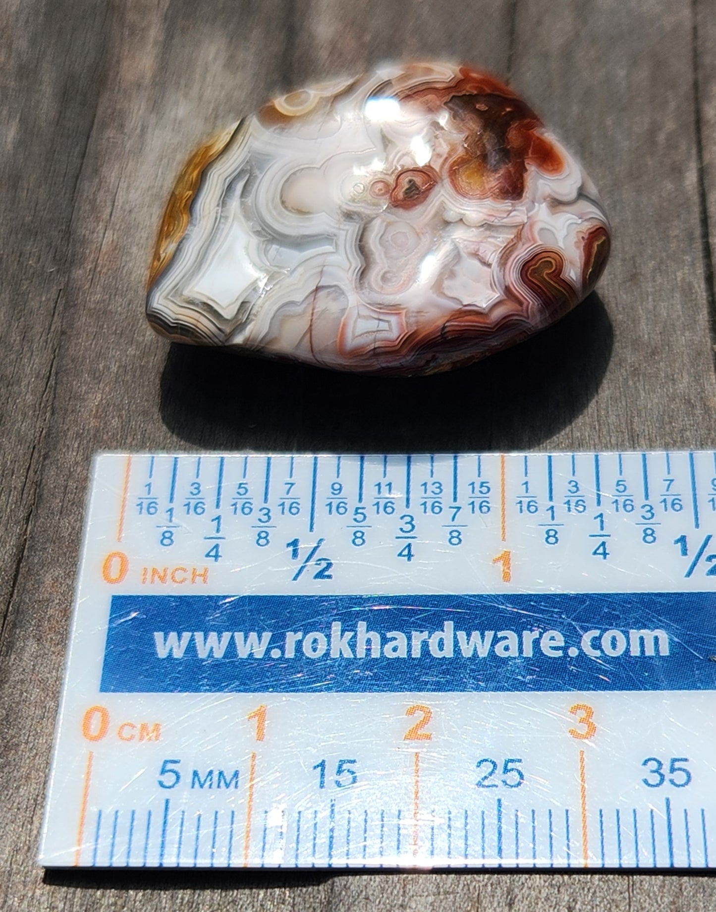 Mexican Crazy Lace Agate displayed with ruler for size reference, TA372