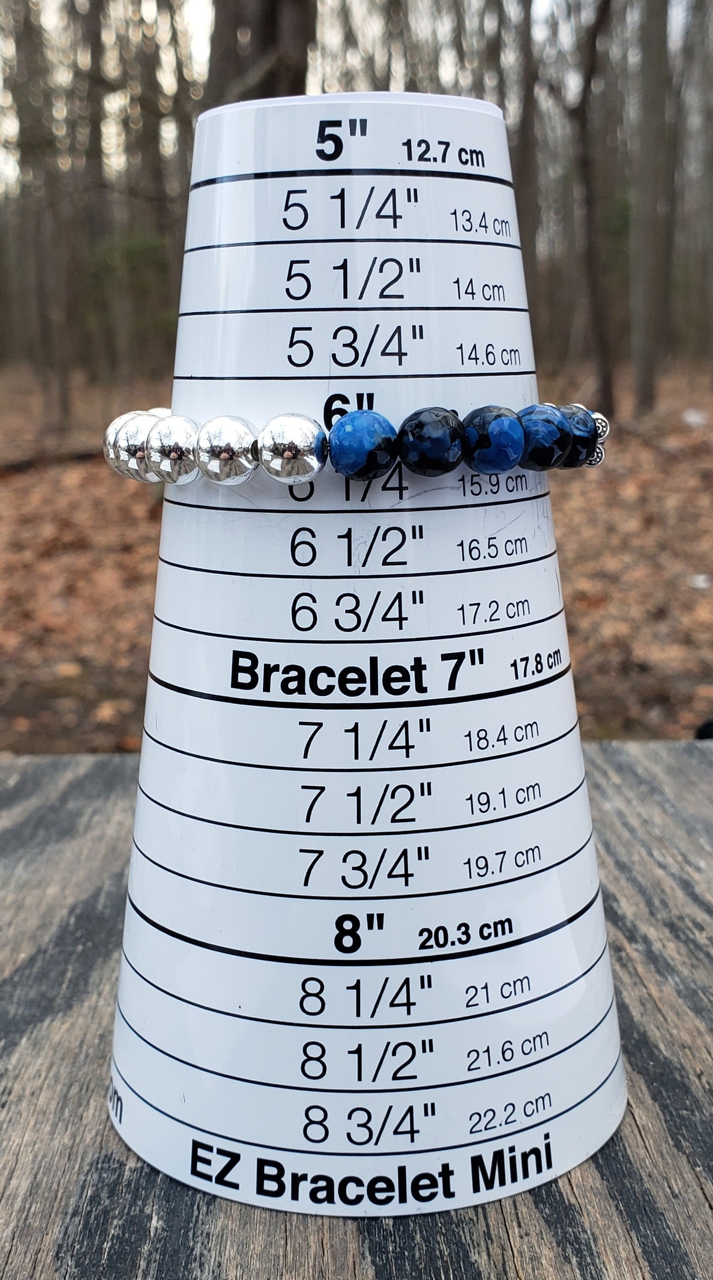 Handmade dyed agate and hematine bracelet on bracelet sizer