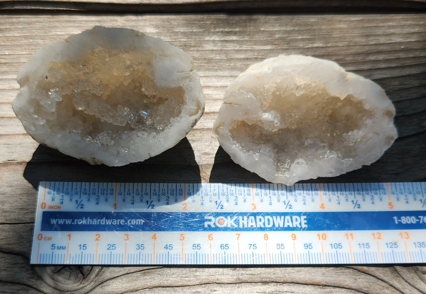 Natural geode specimens shown as a matching set with ruler