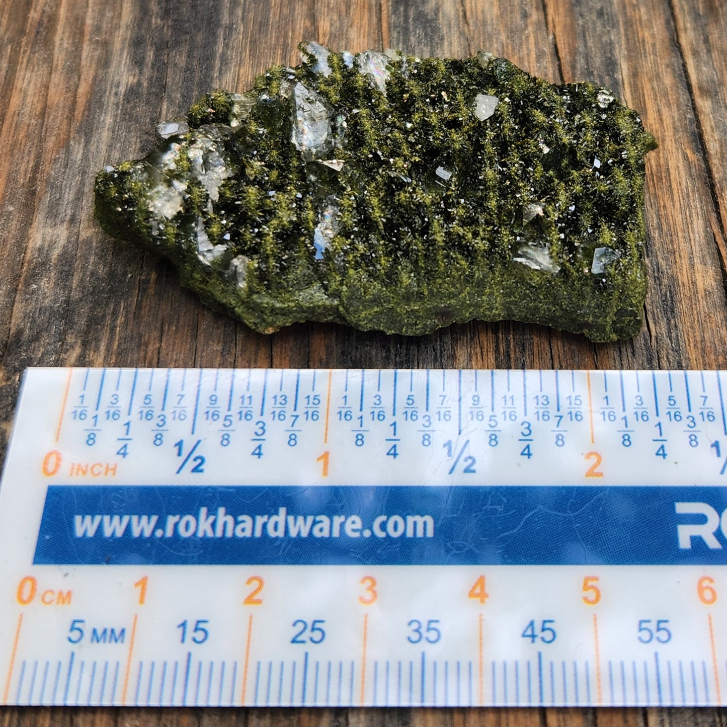Forest epidote with quartz mineral photographed showing size and structure. SP468