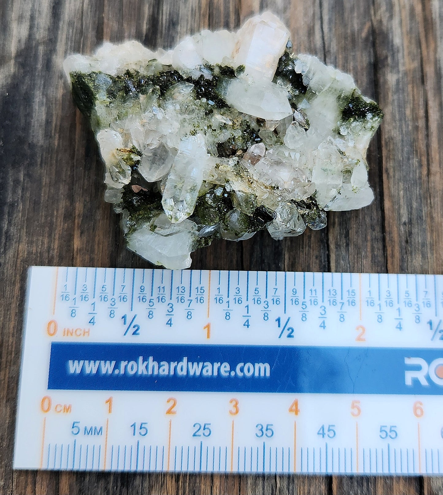 Forest epidote with quartz mineral photographed showing size and structure