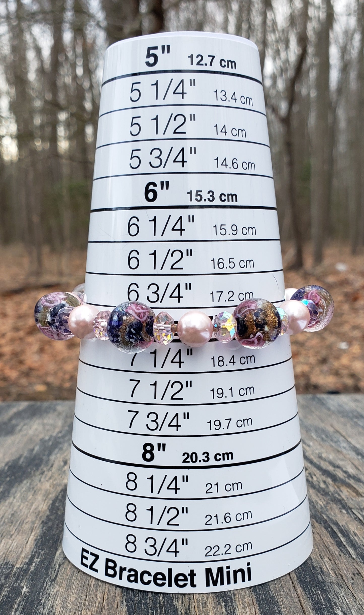 Handmade pink and blue lampwork glass beaded bracelet with clasp on bracelet sizer