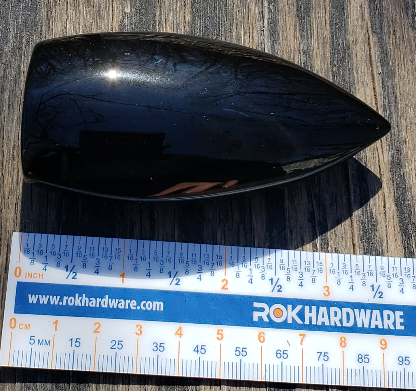 Natural rainbow obsidian freeform flame with ruler