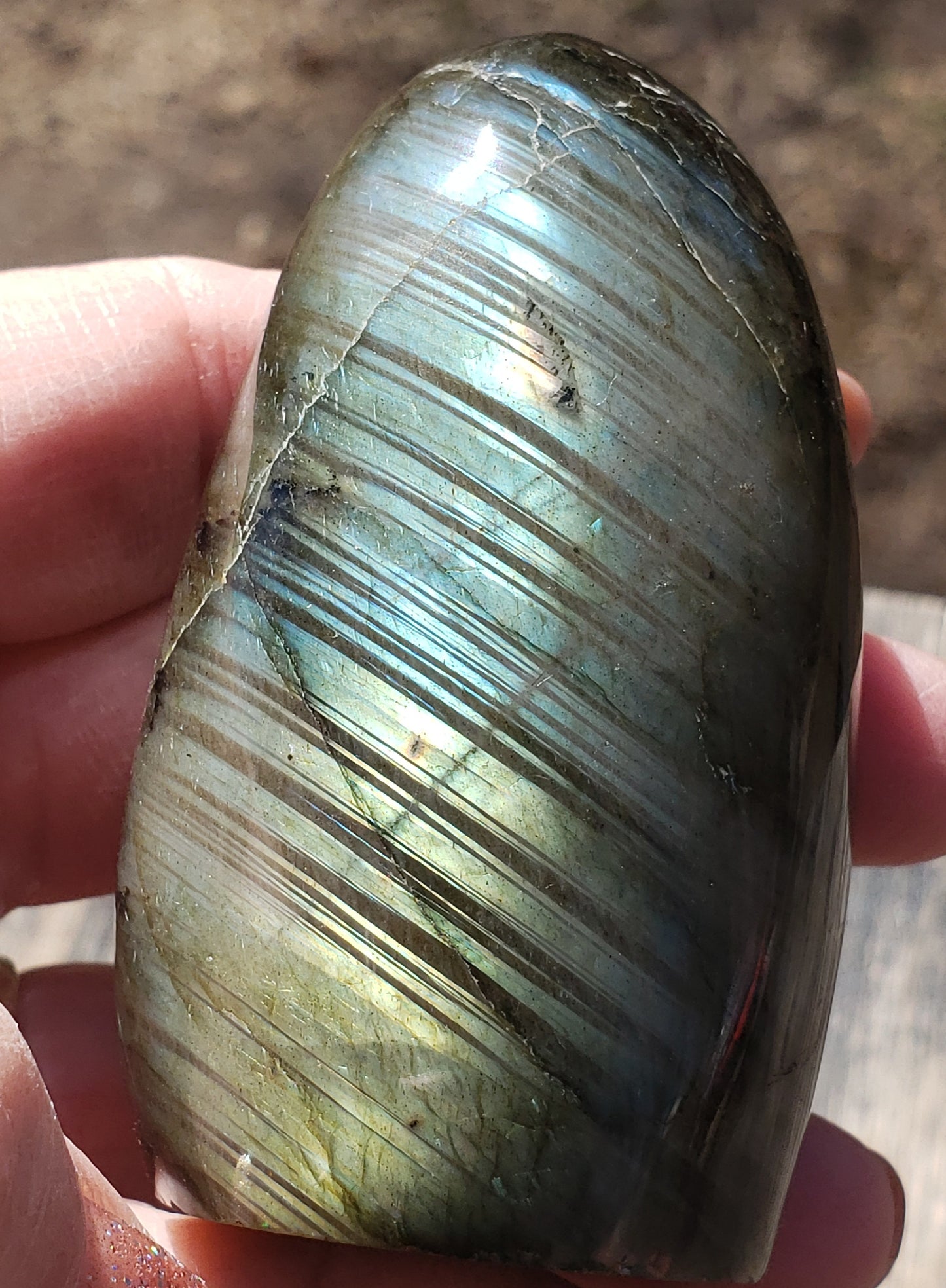 Back of polished labradorite freeform featuring natural linear patterning and smooth polished surface FF03