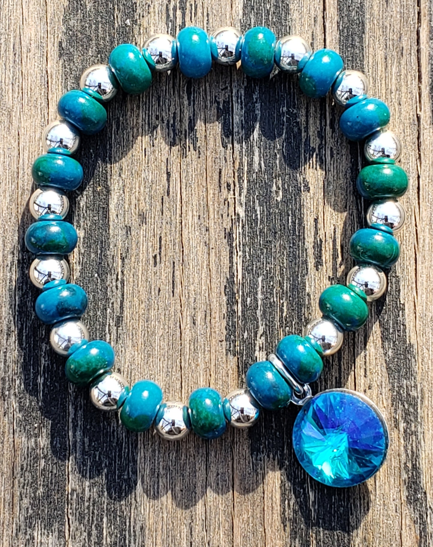 blue green beaded bracelet with glass charm