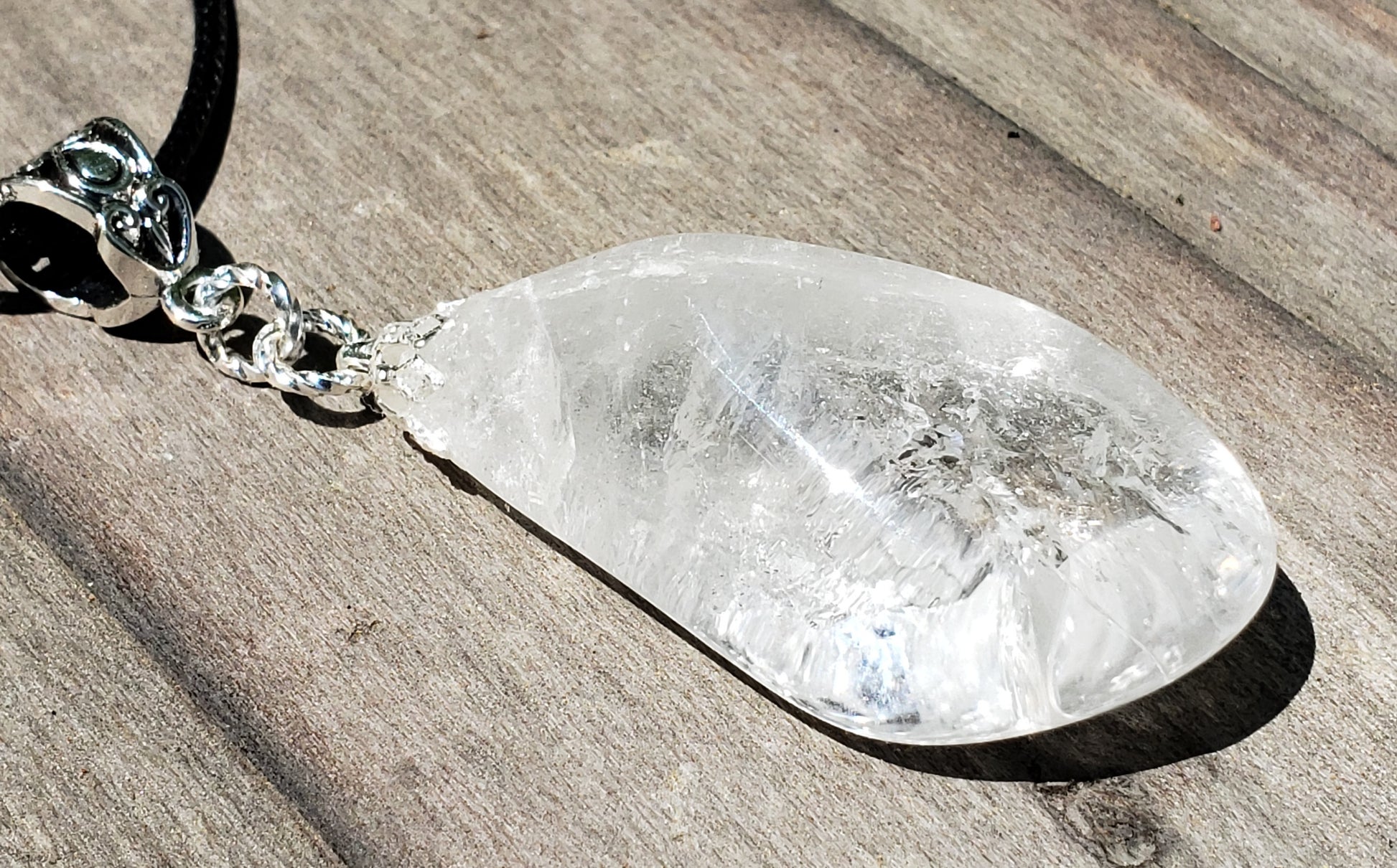 Self-tumbled clear quartz crystal necklace close up 1