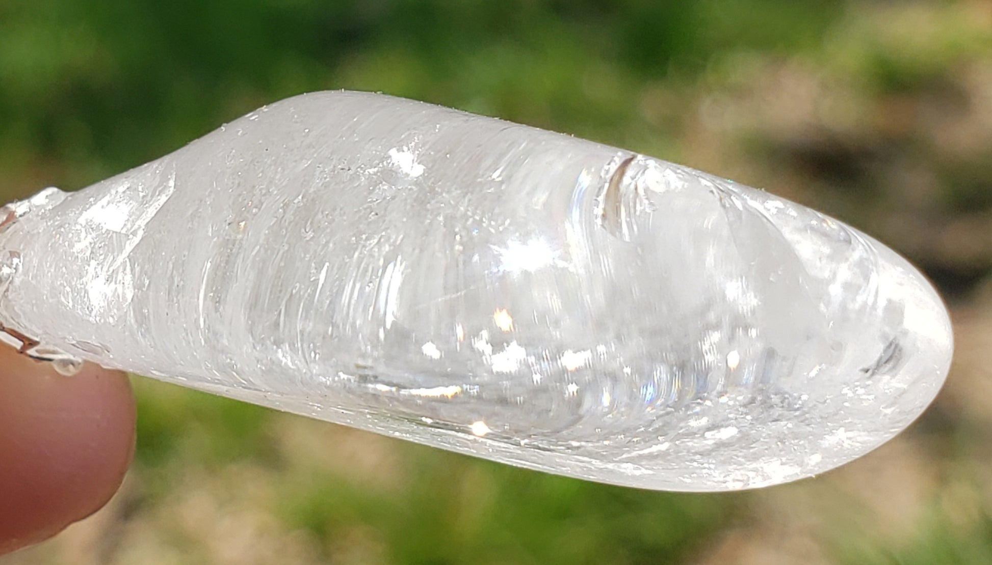 Self-tumbled clear quartz crystal necklace close up