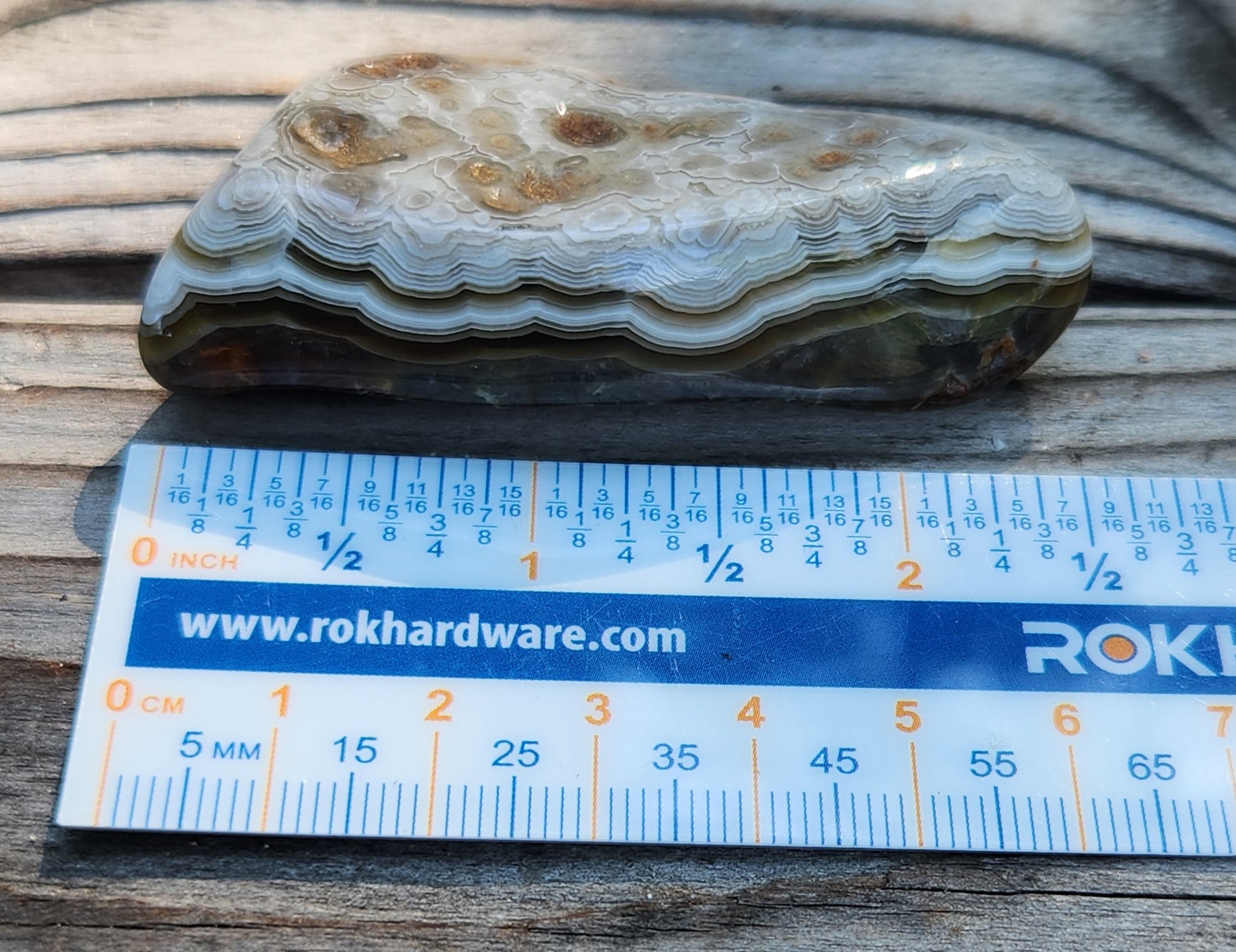 Mexican Crazy Lace Agate shown with ruler for size reference, TA359