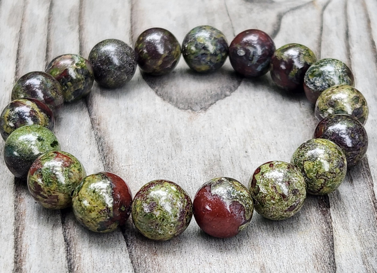 Dragon’s Blood stretch bracelet with 10mm beads close up