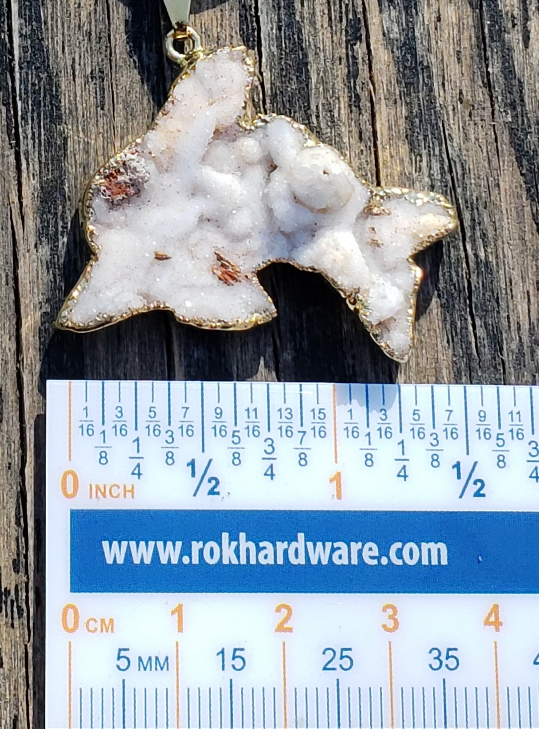 Druzy dolphin necklace shown for size reference