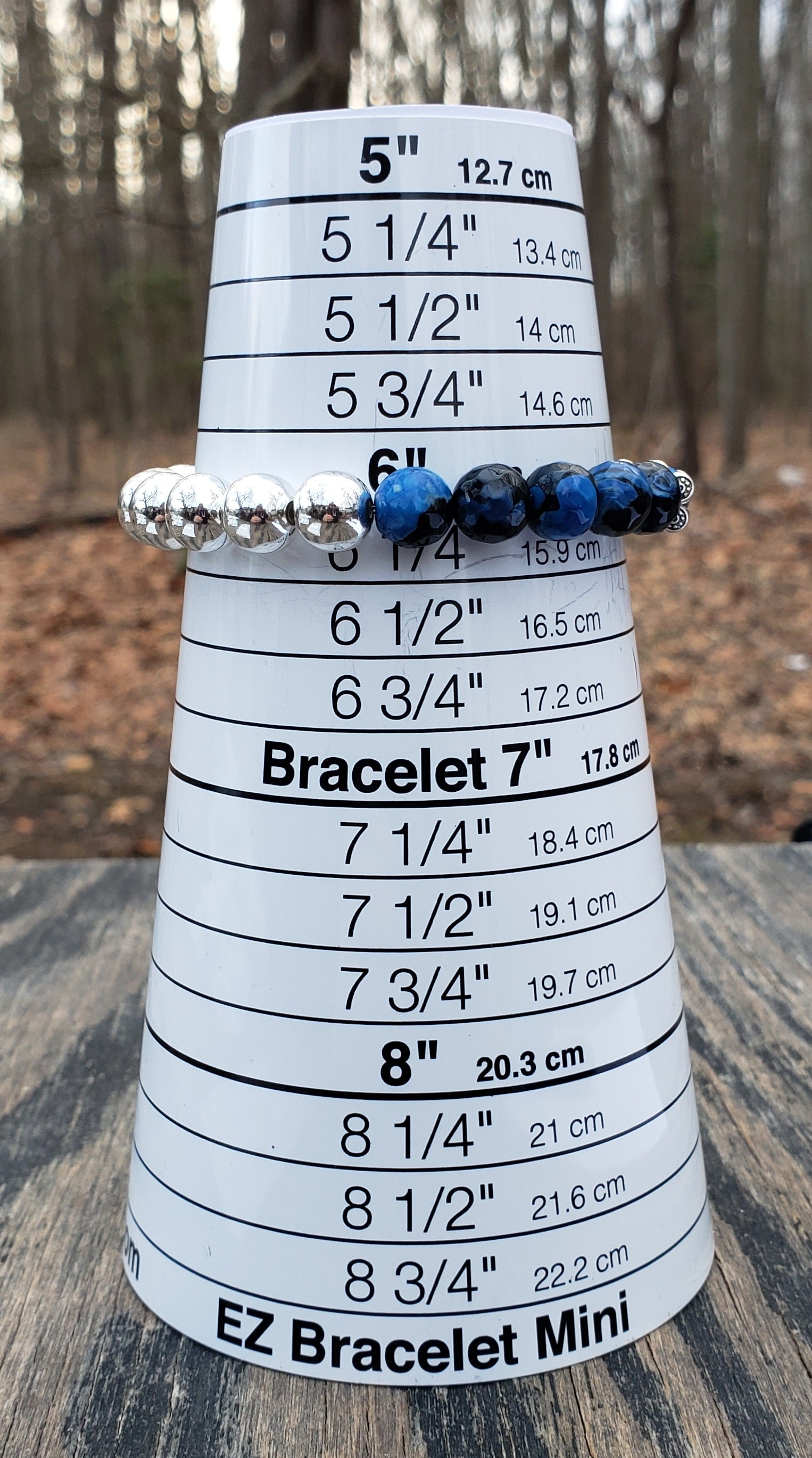 Handmade dyed agate and hematine bracelet on bracelet sizer