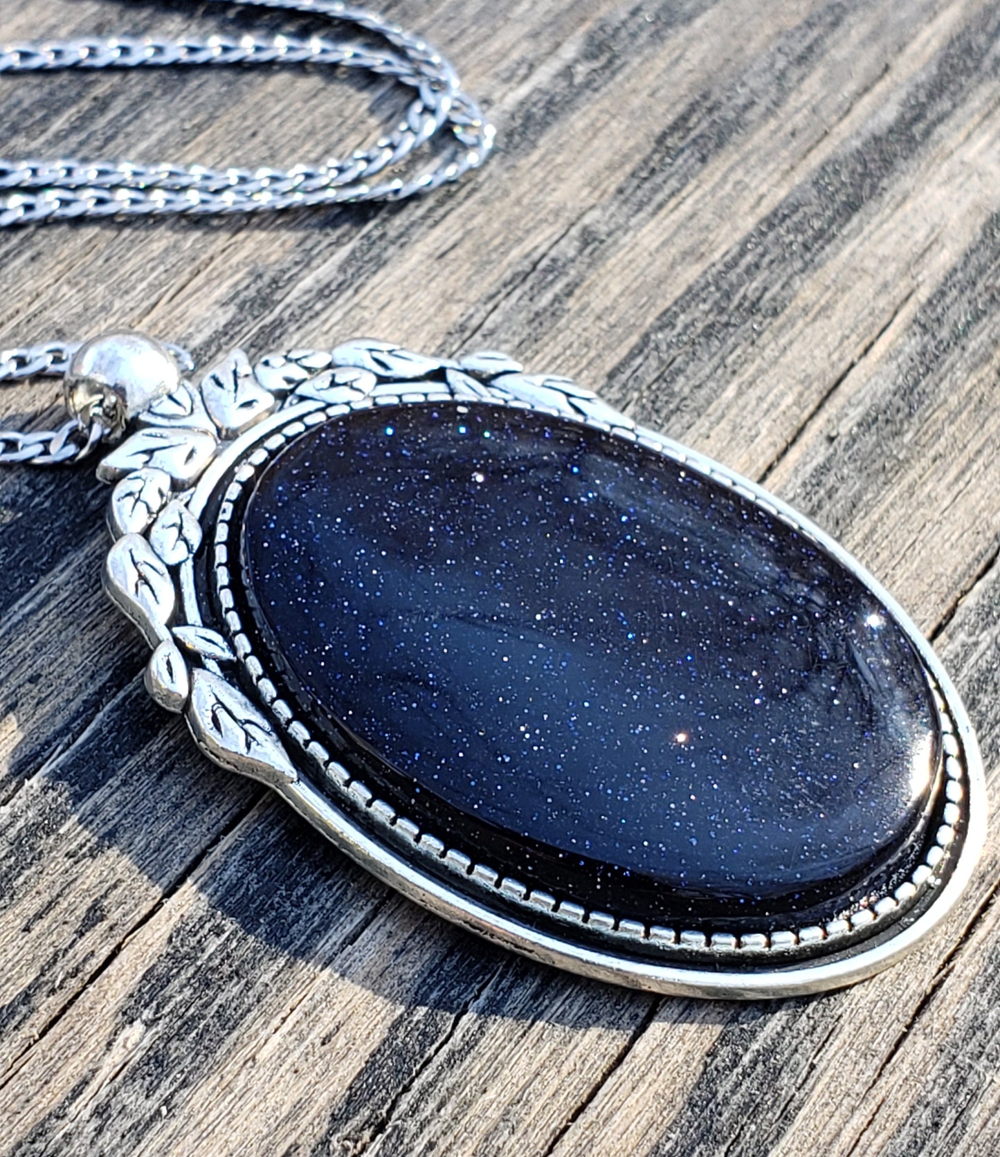 Blue goldstone necklace with 40×30 mm oval stone pendant