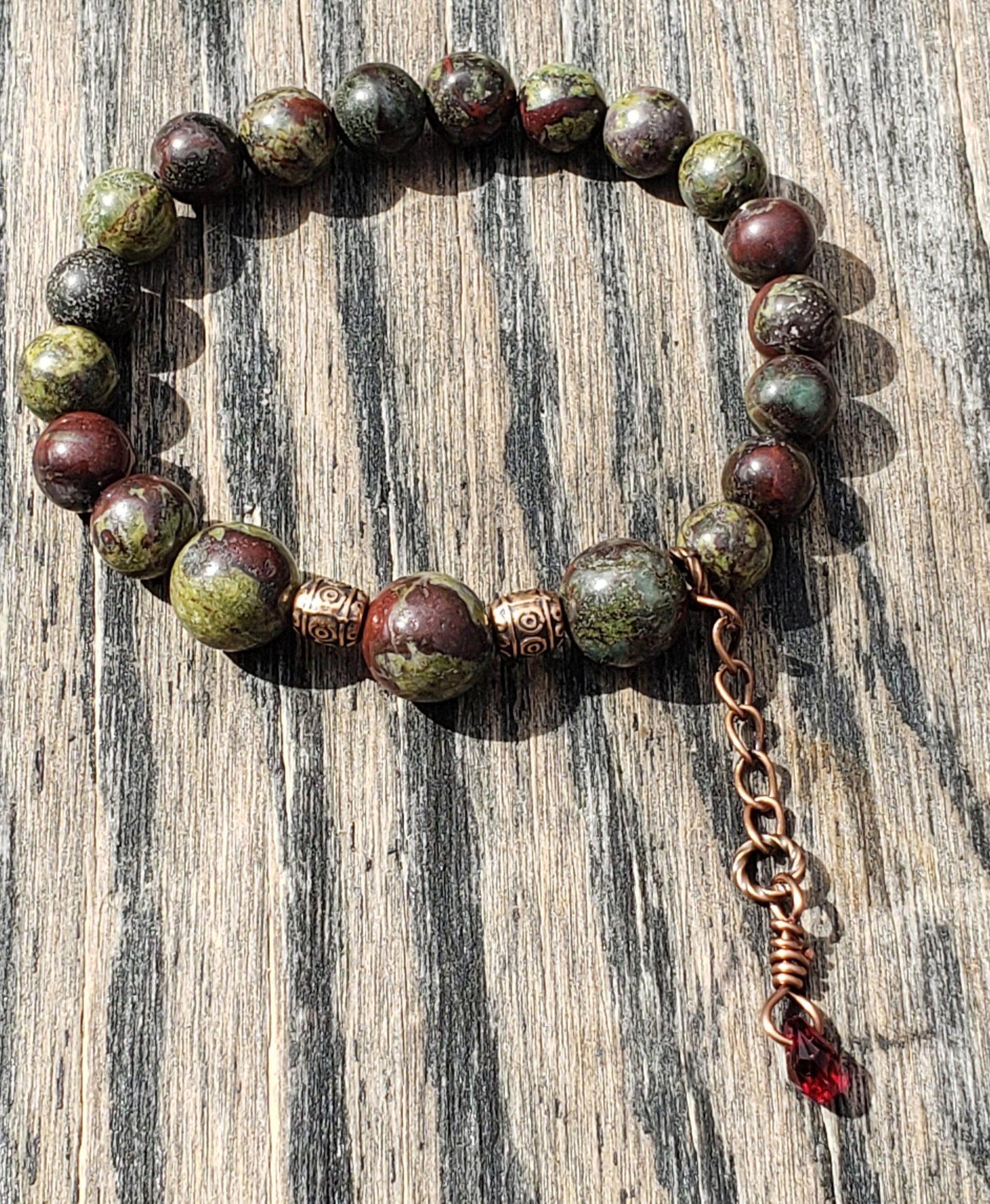 Dragon’s Blood Jasper stretch bracelet with crystal blood-drop dangle charm