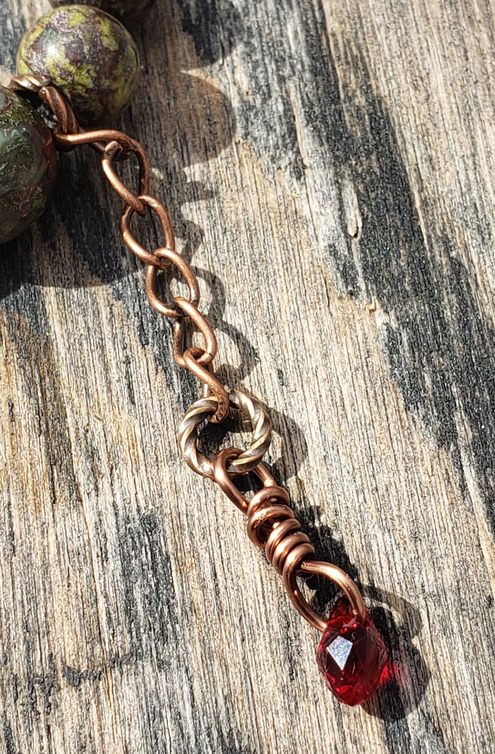 Dragon’s Blood Jasper stretch bracelet with close up of crystal blood-drop dangle charm 