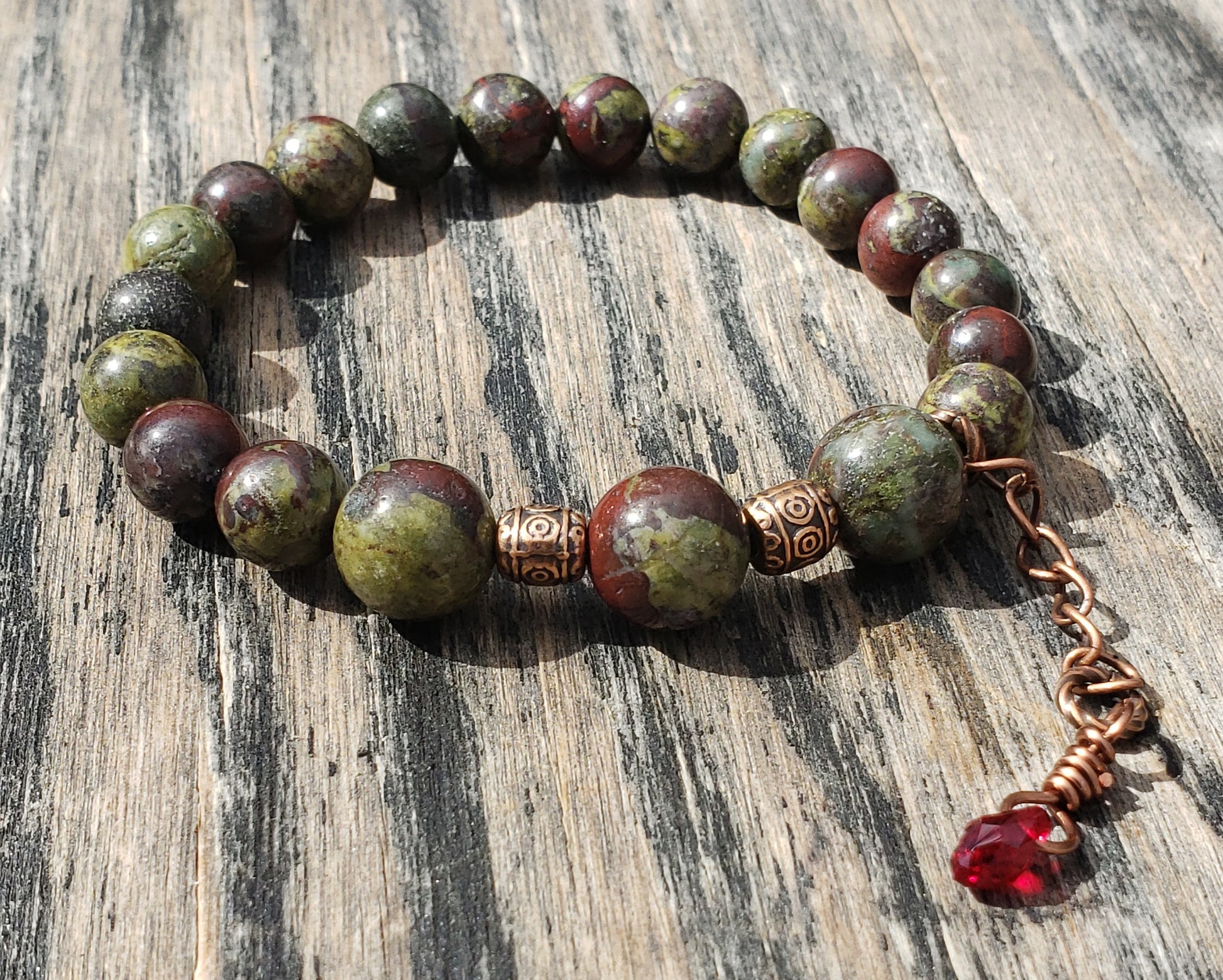 Dragon’s Blood Jasper stretch bracelet with crystal blood-drop dangle charm
