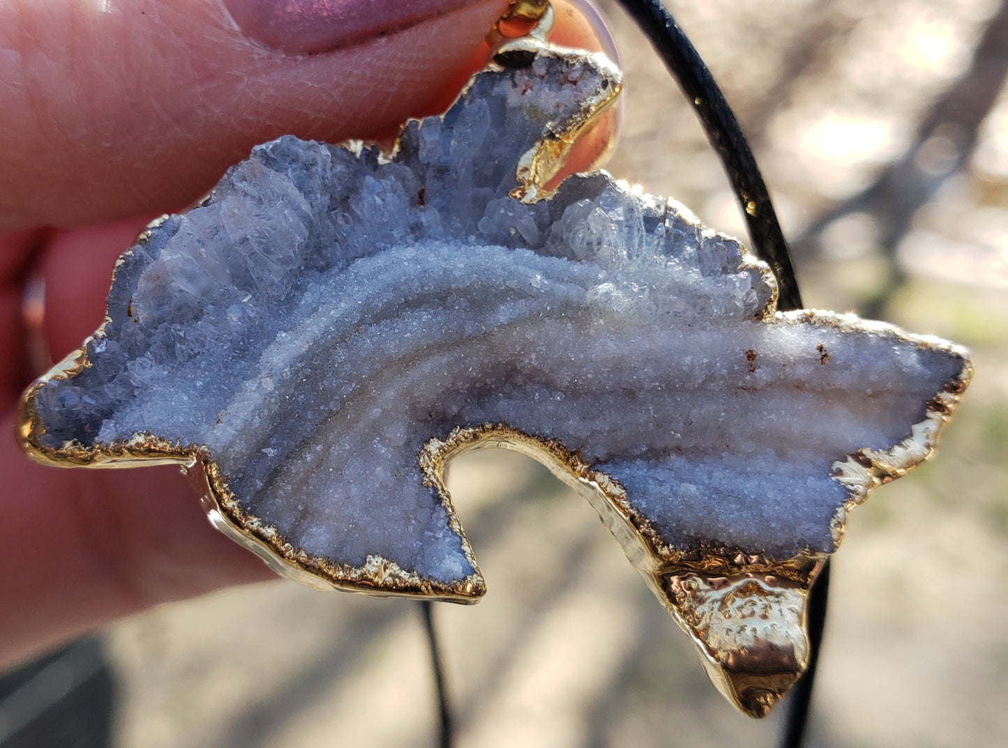 Druzy dolphin necklace with natural crystal sparkle close up of crystals