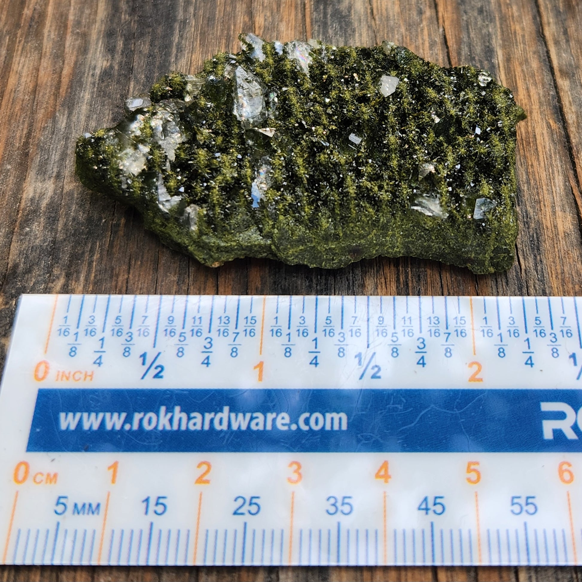 Forest epidote with quartz mineral photographed showing size and structure. SP468