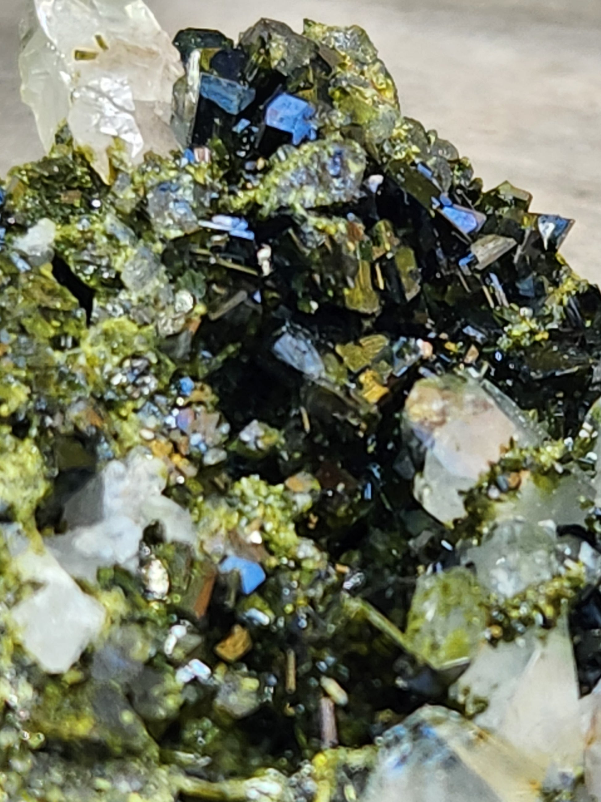 Close-up of green epidote crystals and clear quartz on natural matrix from Hakkari Turkey. SP454