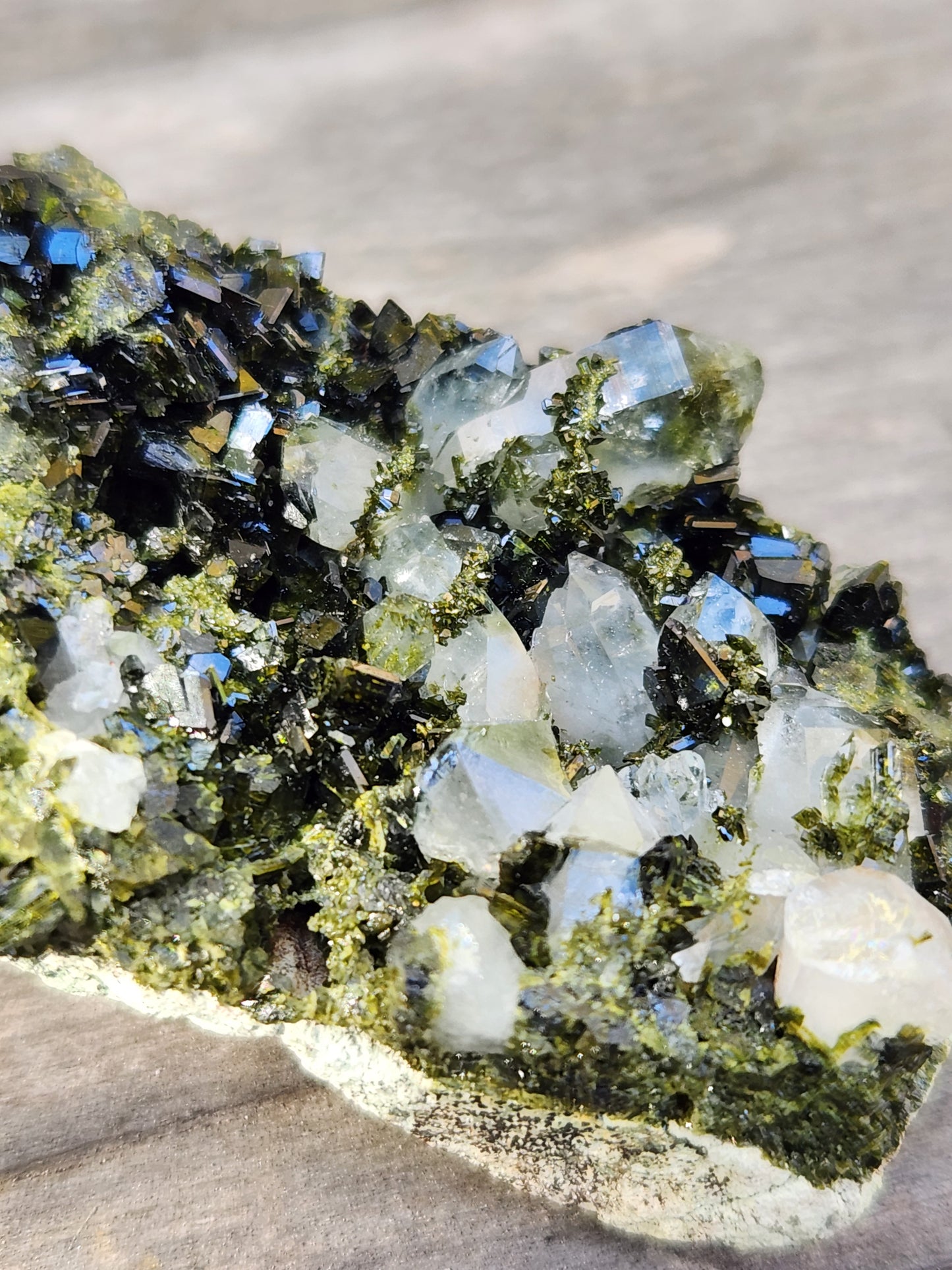 Close-up of green epidote crystals and clear quartz on natural matrix from Hakkari Turkey. SP454-01