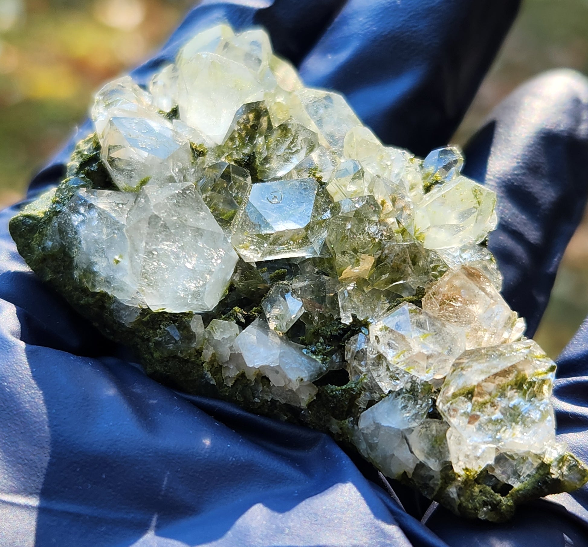 Close-up of green epidote crystals and clear quartz on natural matrix from Hakkari Turkey. SP458
