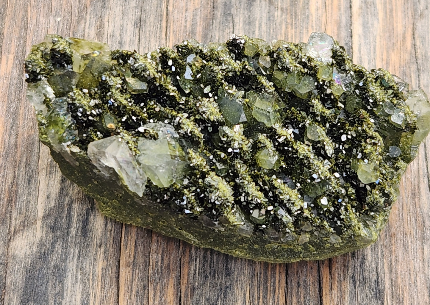 Close-up of green epidote crystals and clear quartz on natural matrix from Hakkari Turkey. SP464