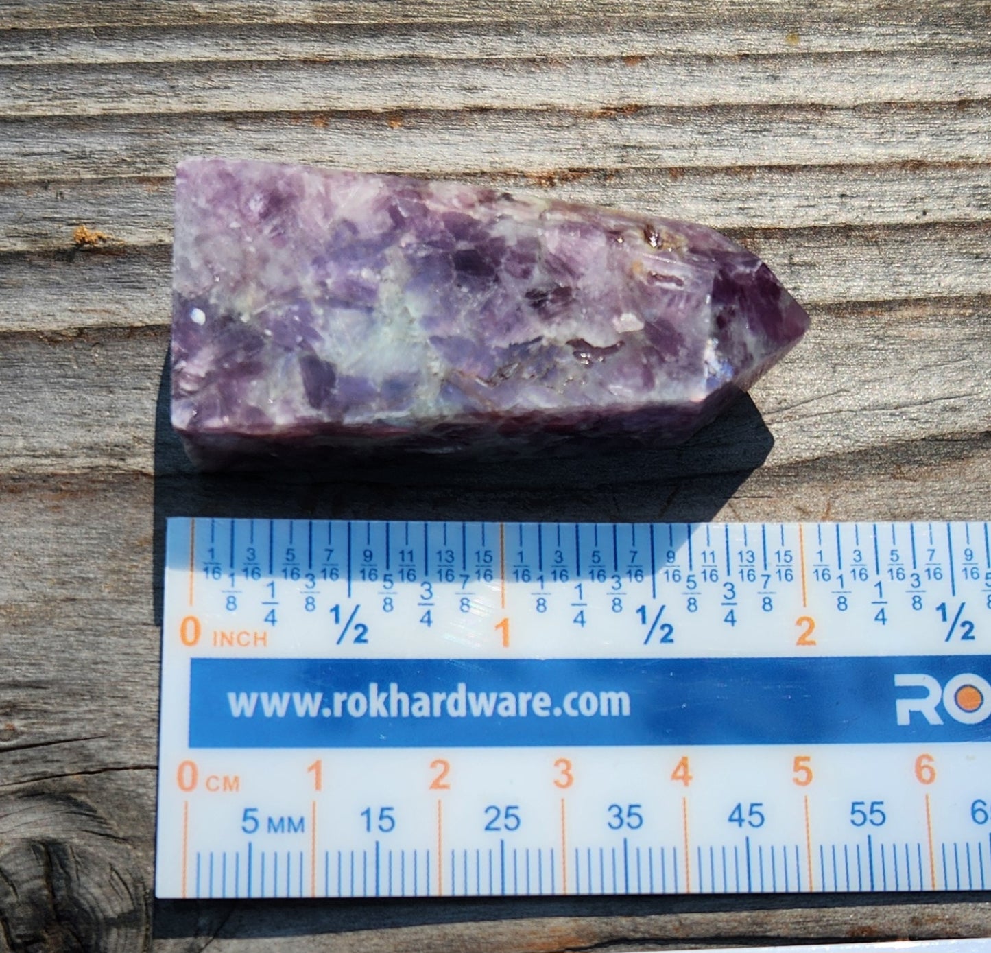 Polished lepidolite mini tower crystal with lavender tones ruler