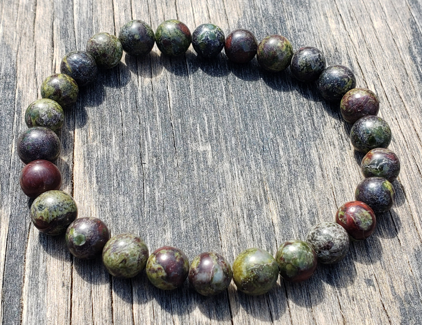 Handmade Dragon’s Blood men’s bracelet close up of colors