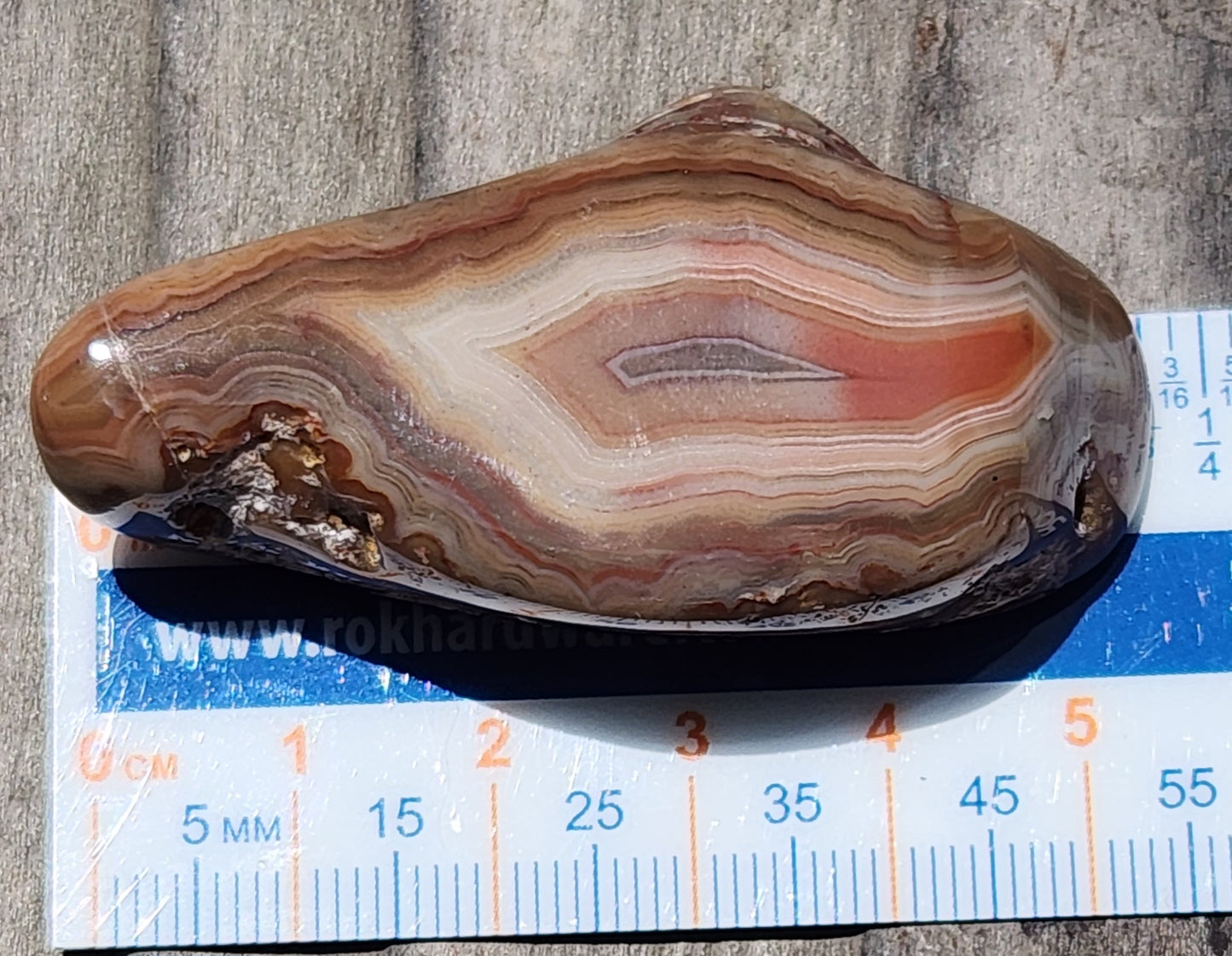 Layered chalcedony agate with horizontal fortification pattern with ruler TA263