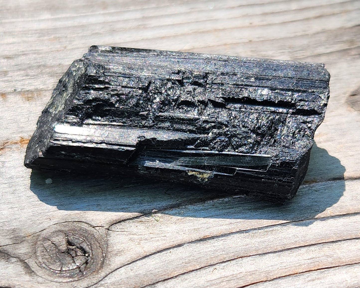 Rough black tourmaline mineral specimen with well-defined striation texture, item RC423