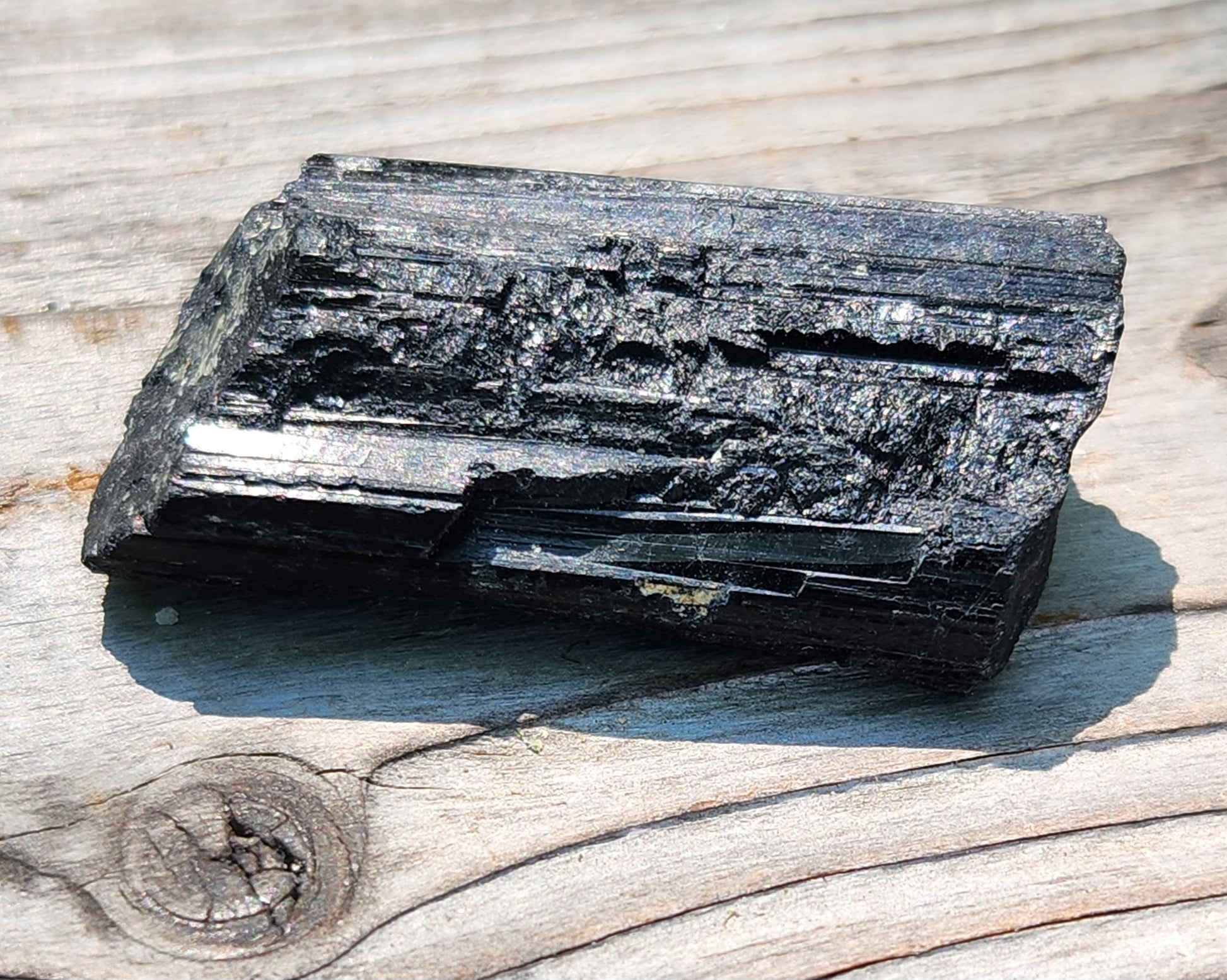 Rough black tourmaline mineral specimen with well-defined striation texture, item RC423