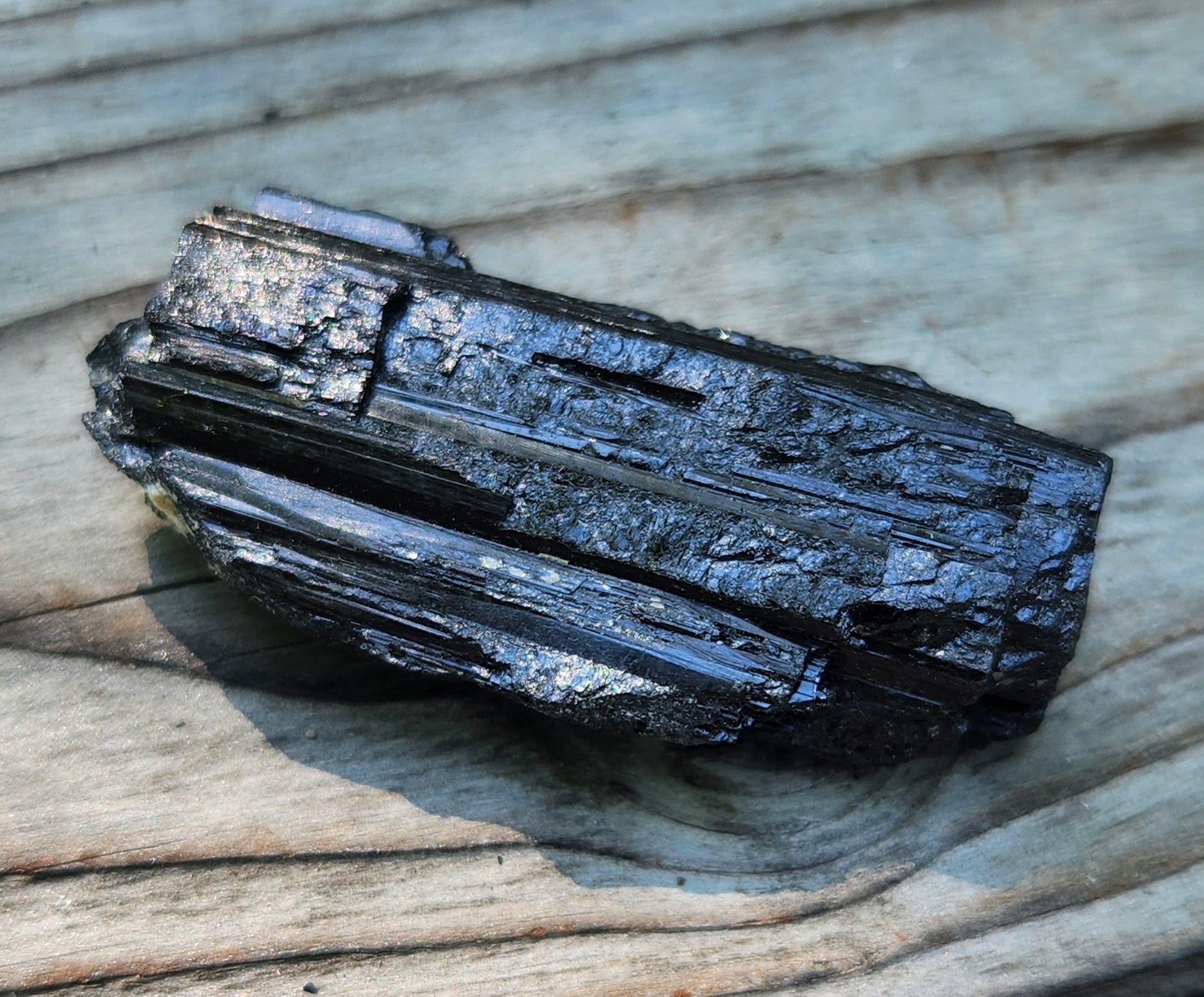 Rough black tourmaline mineral specimen with well-defined striation texture, item RC425