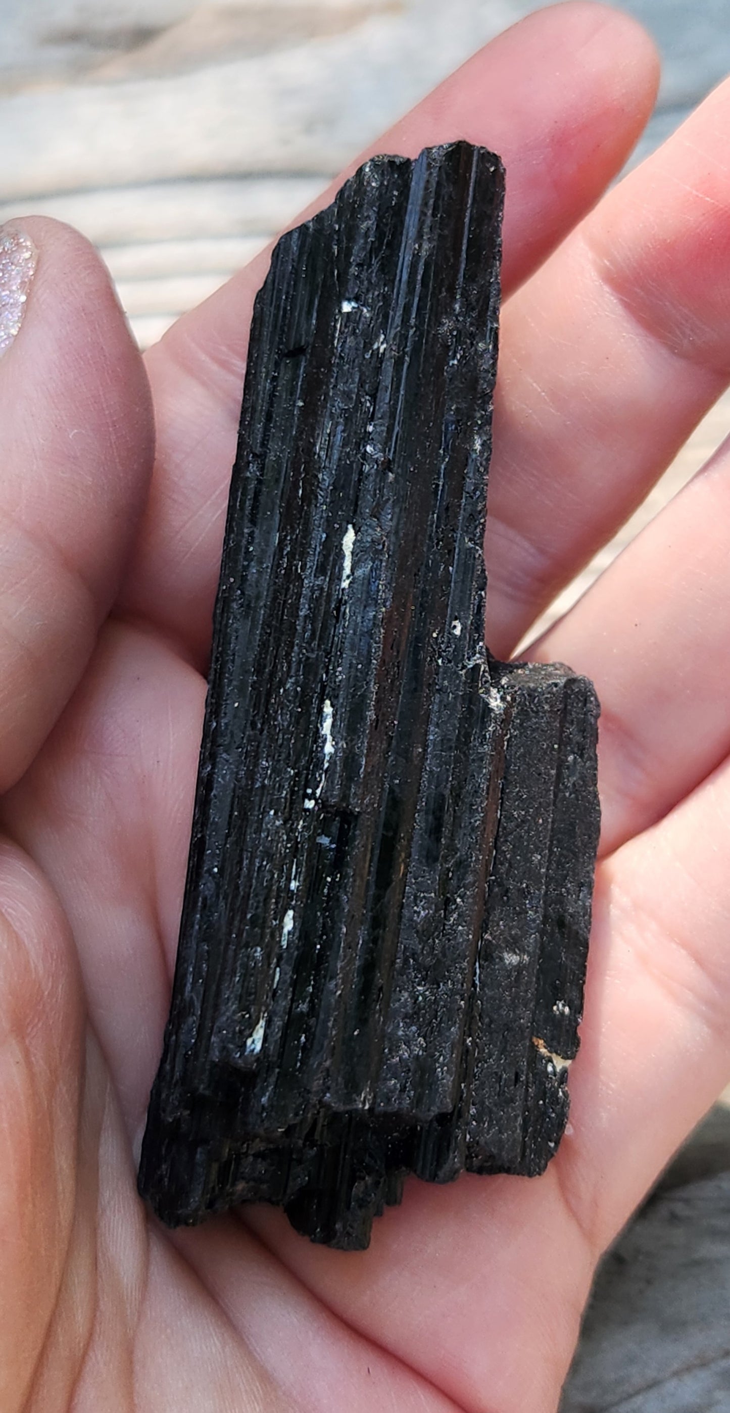 Rough black tourmaline mineral specimen with well-defined striation texture, item RC430