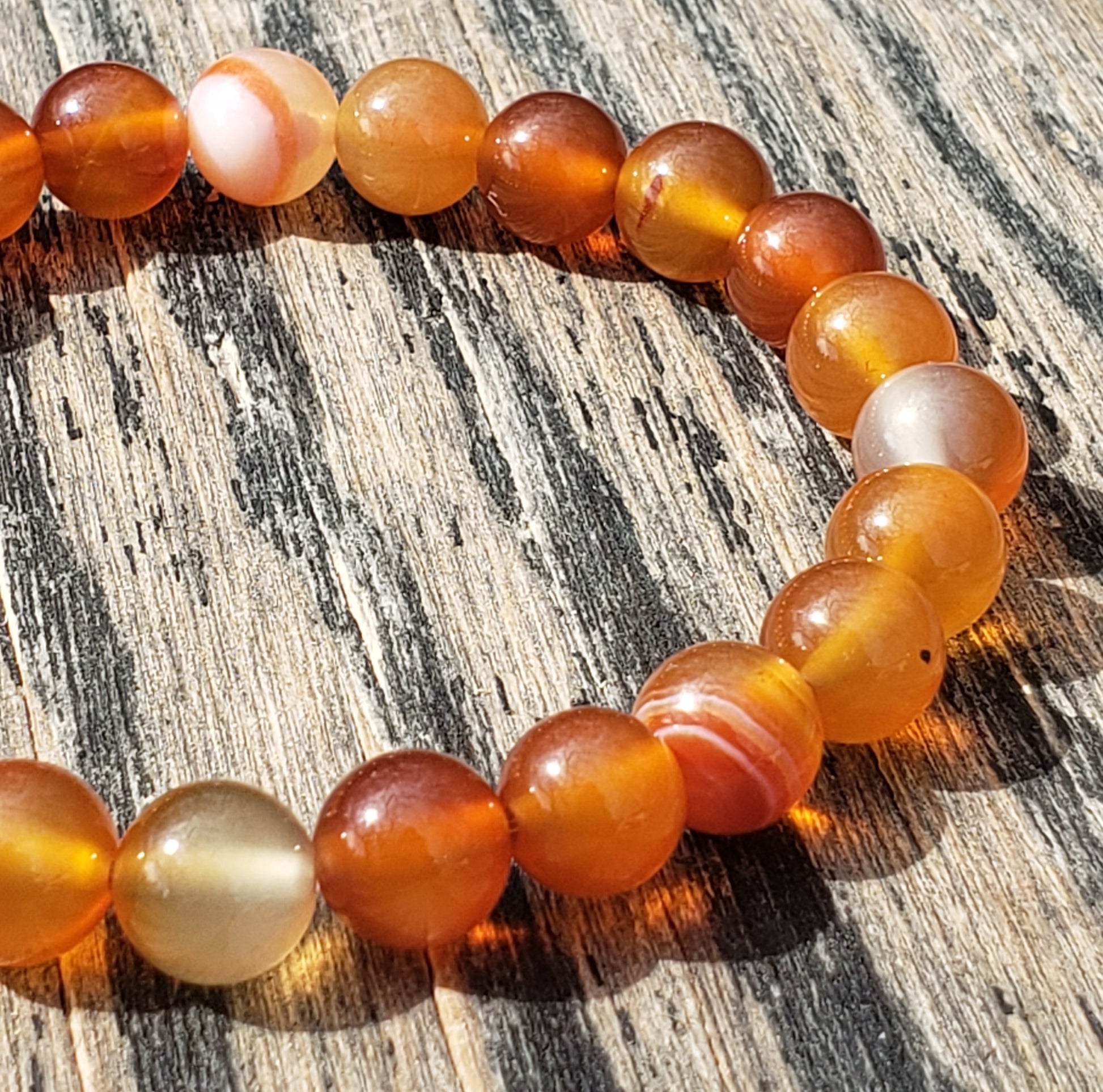 Orange agate stretch bracelet close up of agate bands