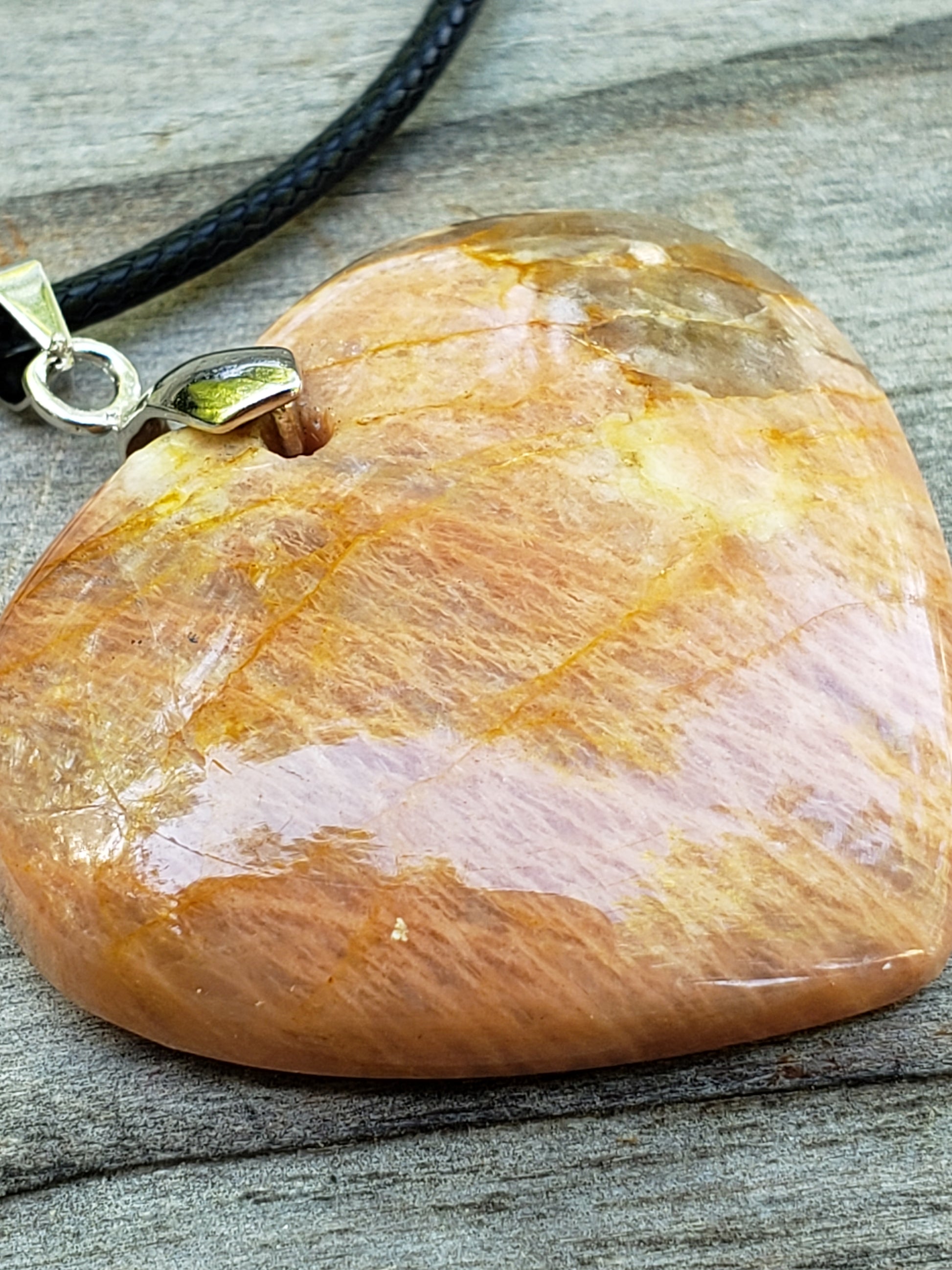 Handmade peach moonstone heart necklace close up