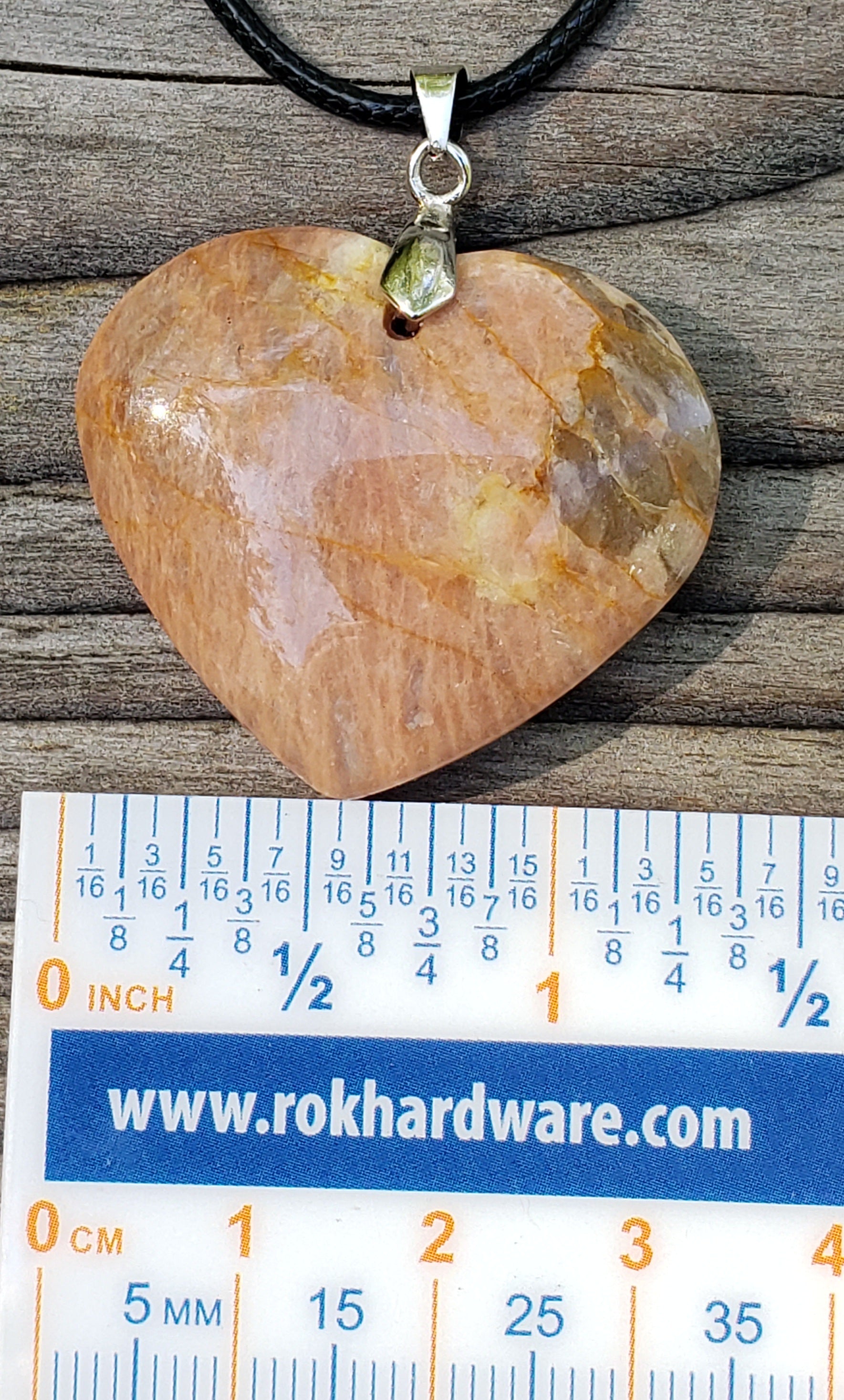 Handmade peach moonstone heart necklace with ruler