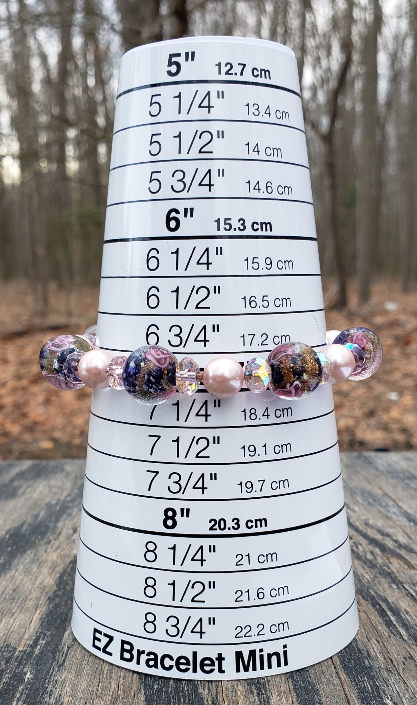 Handmade pink and blue lampwork glass beaded bracelet with clasp on bracelet sizer