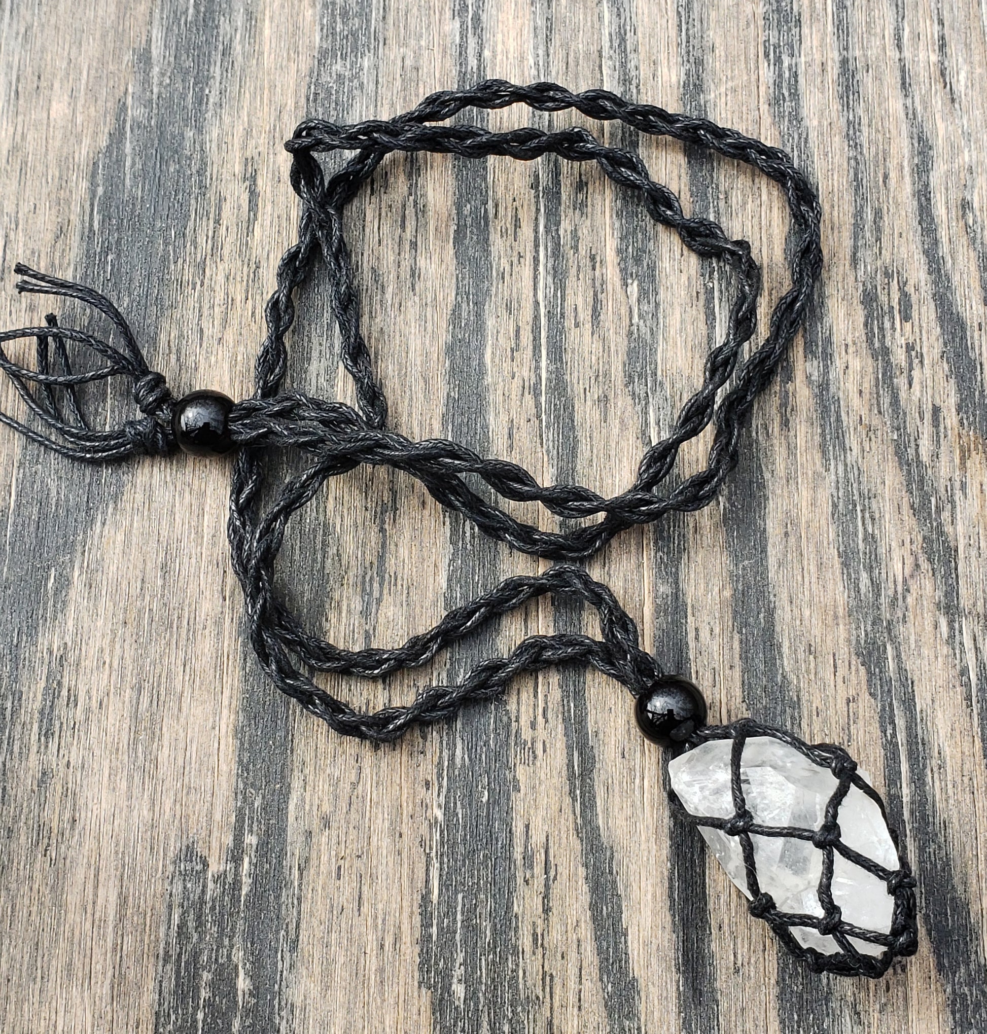 Quartz crystal point necklace with net macrame cord