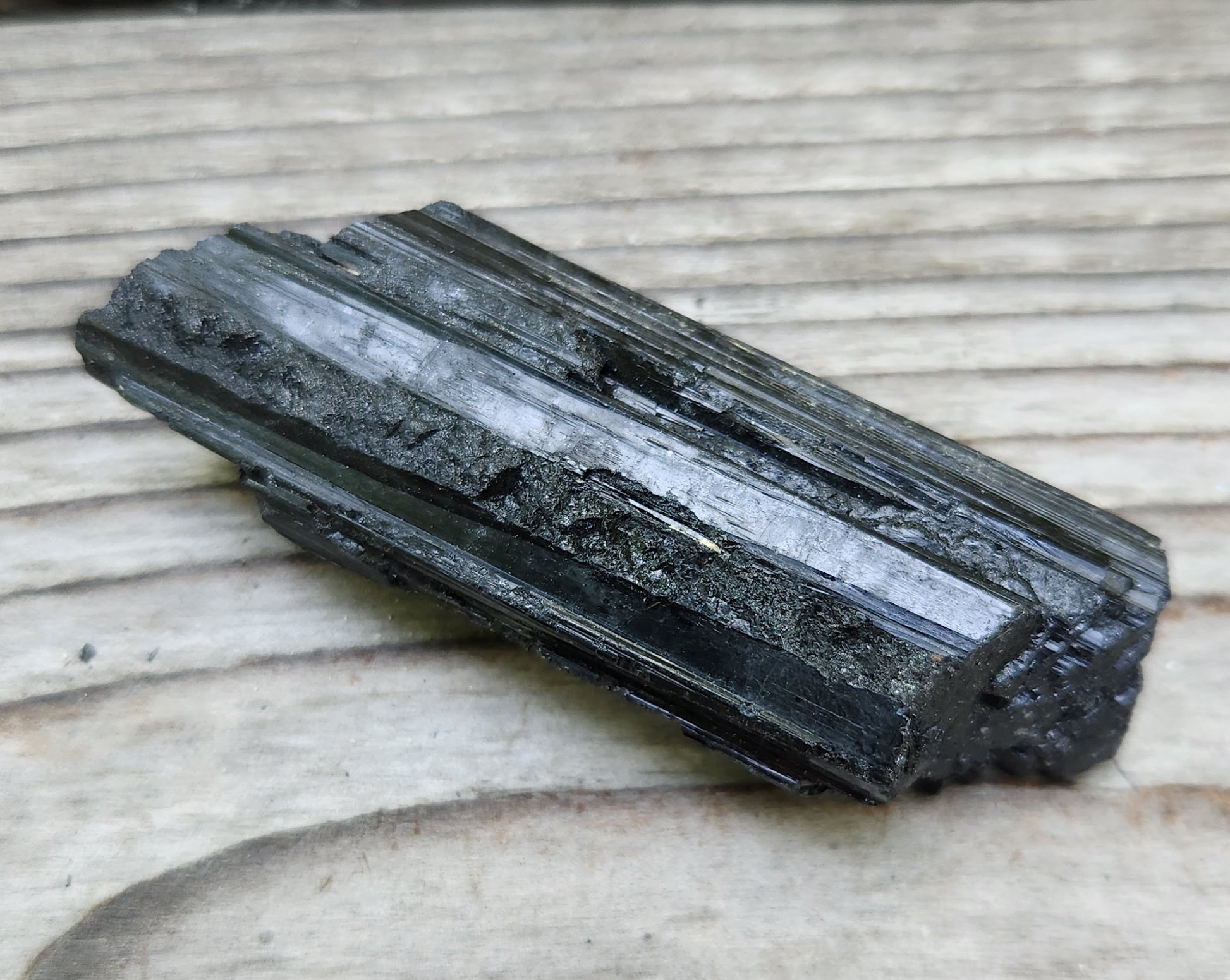Raw black tourmaline crystal with natural prismatic growth and vertical striations, item RC428