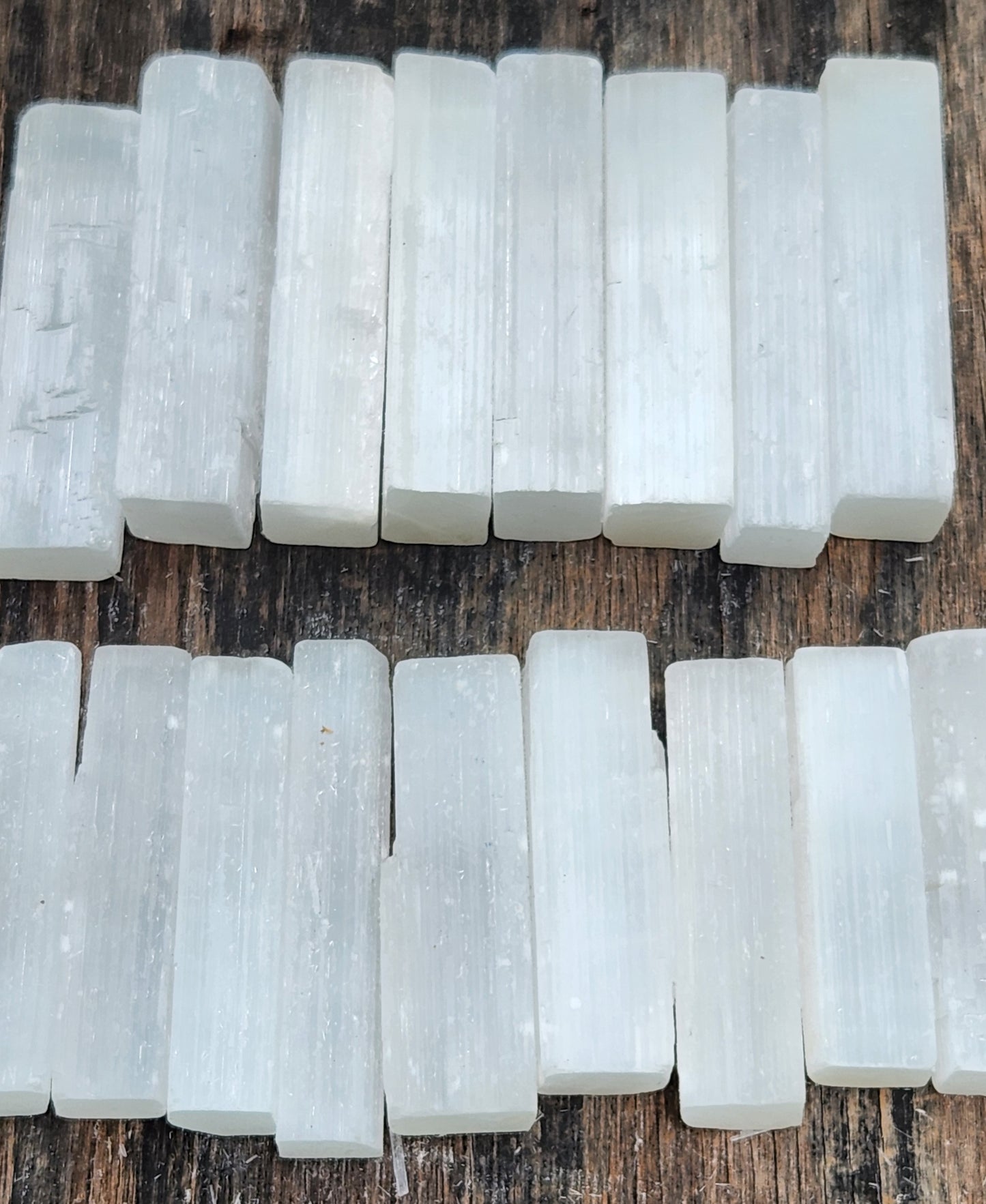 Natural selenite stick wand 2.5 to 3 inches on table
