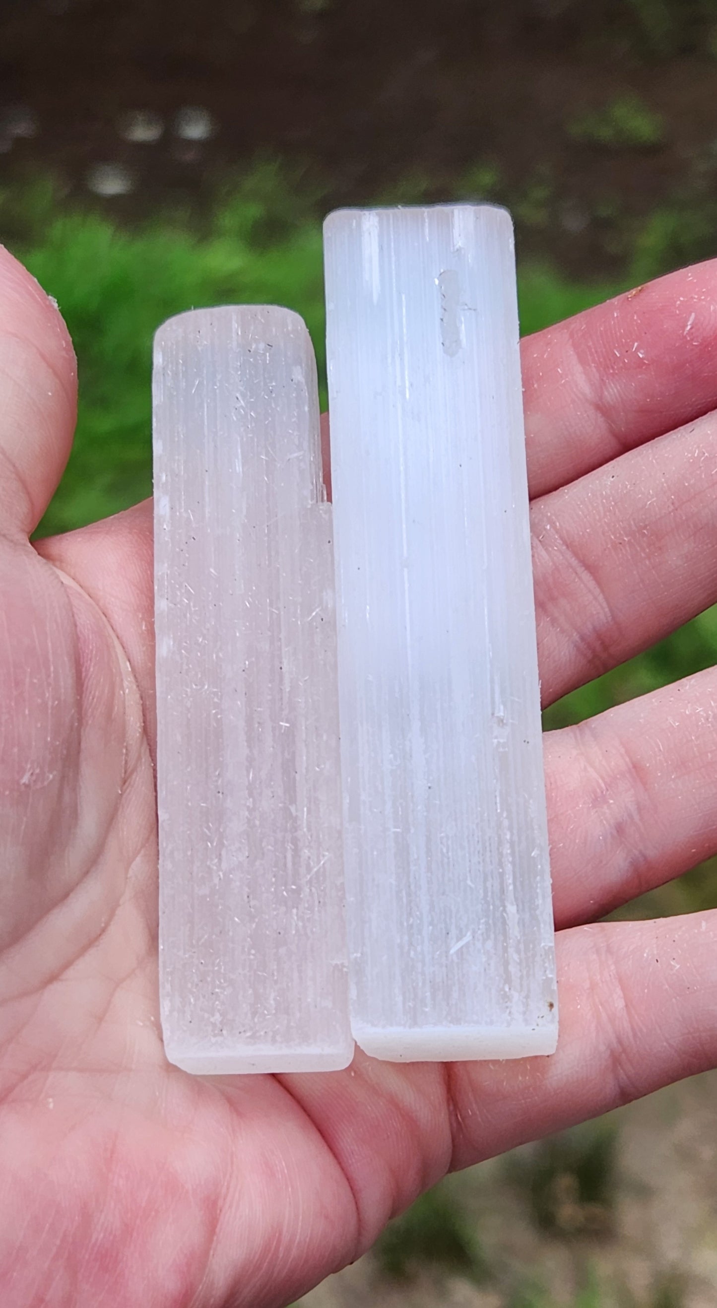 Natural selenite stick wand 2.5 to 3 inches in hand for size differences 