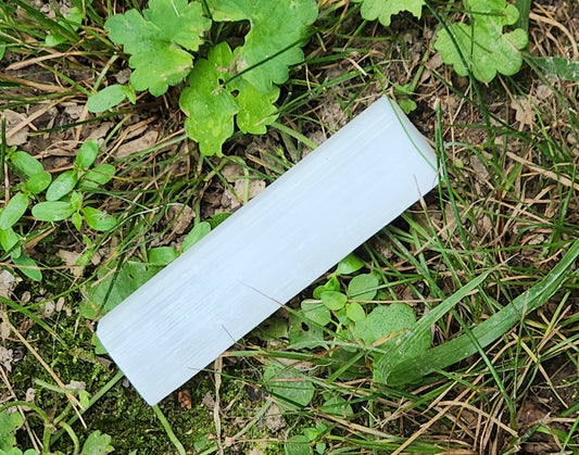 Natural selenite stick wand 2.5 to 3 inches in grass