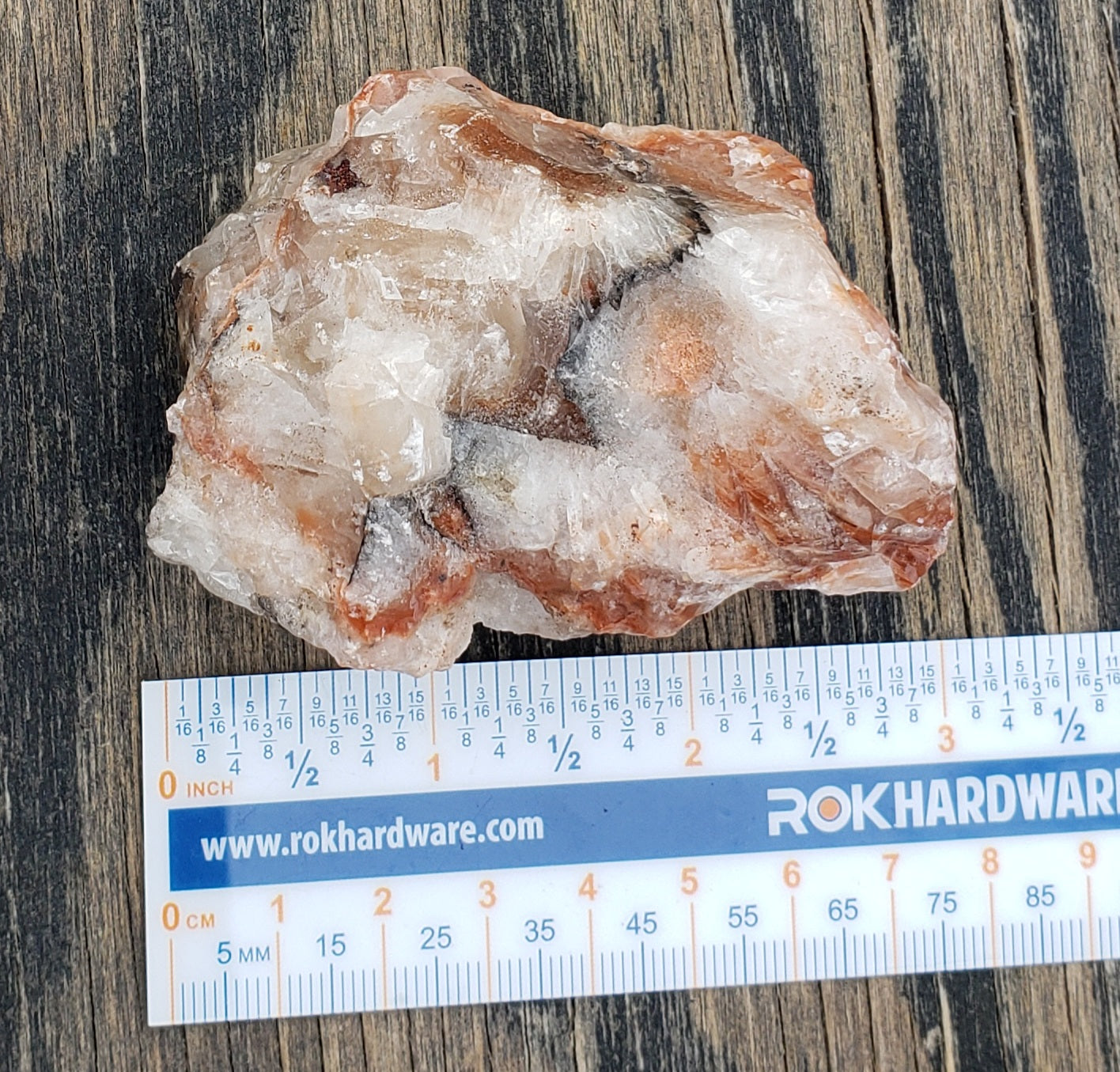 Tri-color calcite rough rock with ruler for size