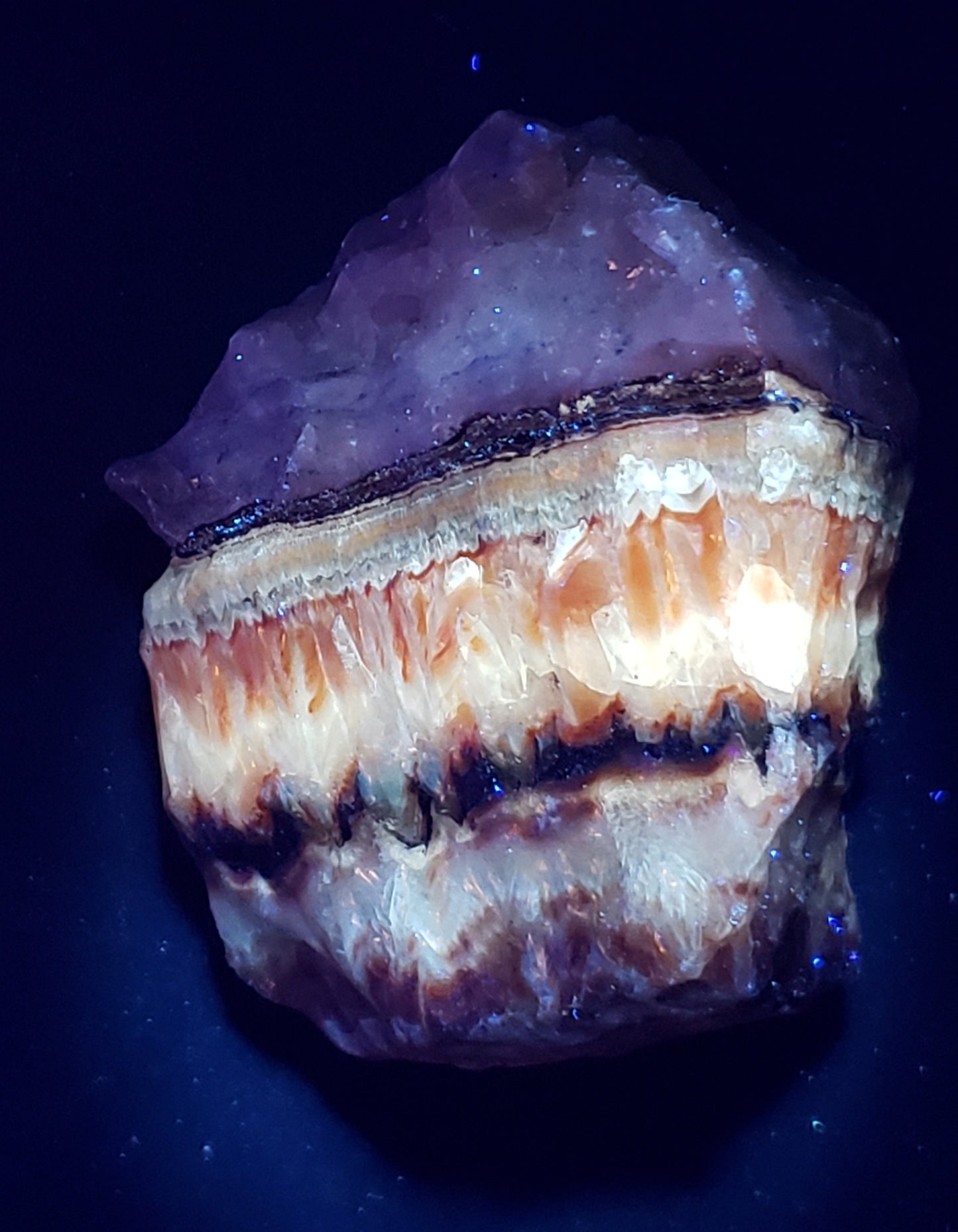 Tri-color calcite rough rock with UV reactive light