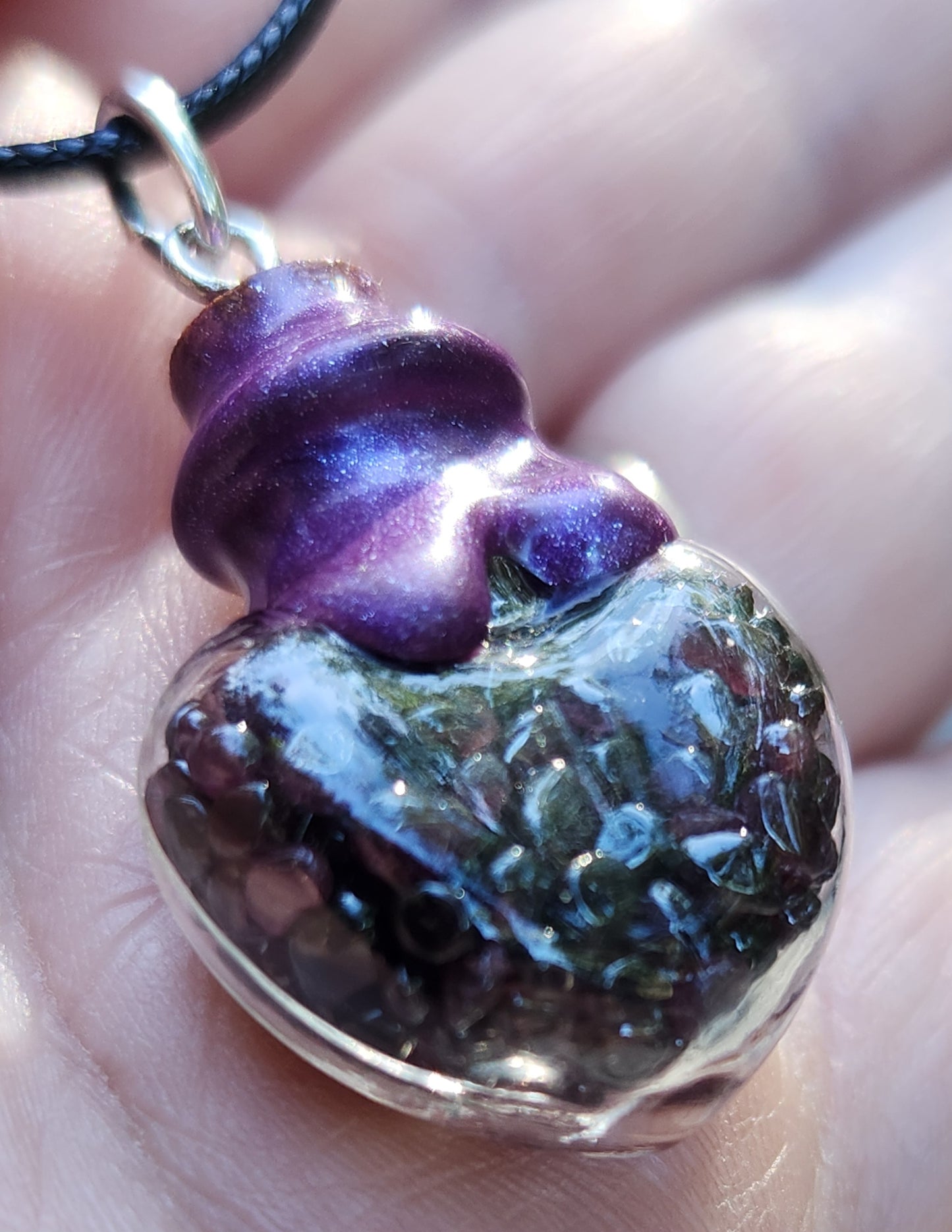 Tumbled garnet gemstone necklace in glass bottle pendant