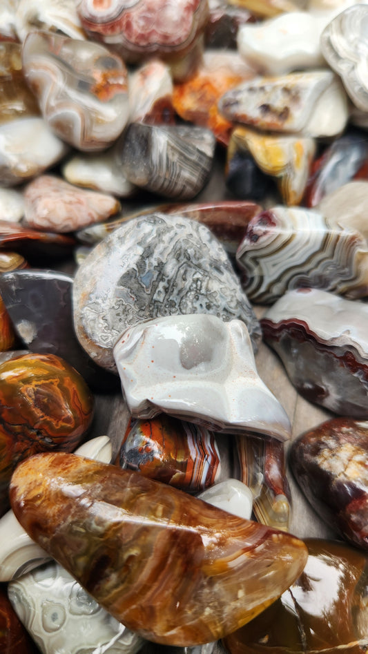 2 ounce bag of in-house tumbled Mexican Crazy Lace Agate stones with natural lace banding, TA386