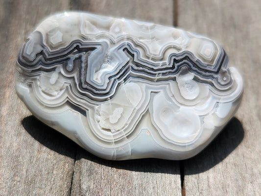 In-house tumbled Mexican Crazy Lace Agate with gray and cream fortification banding, TA368