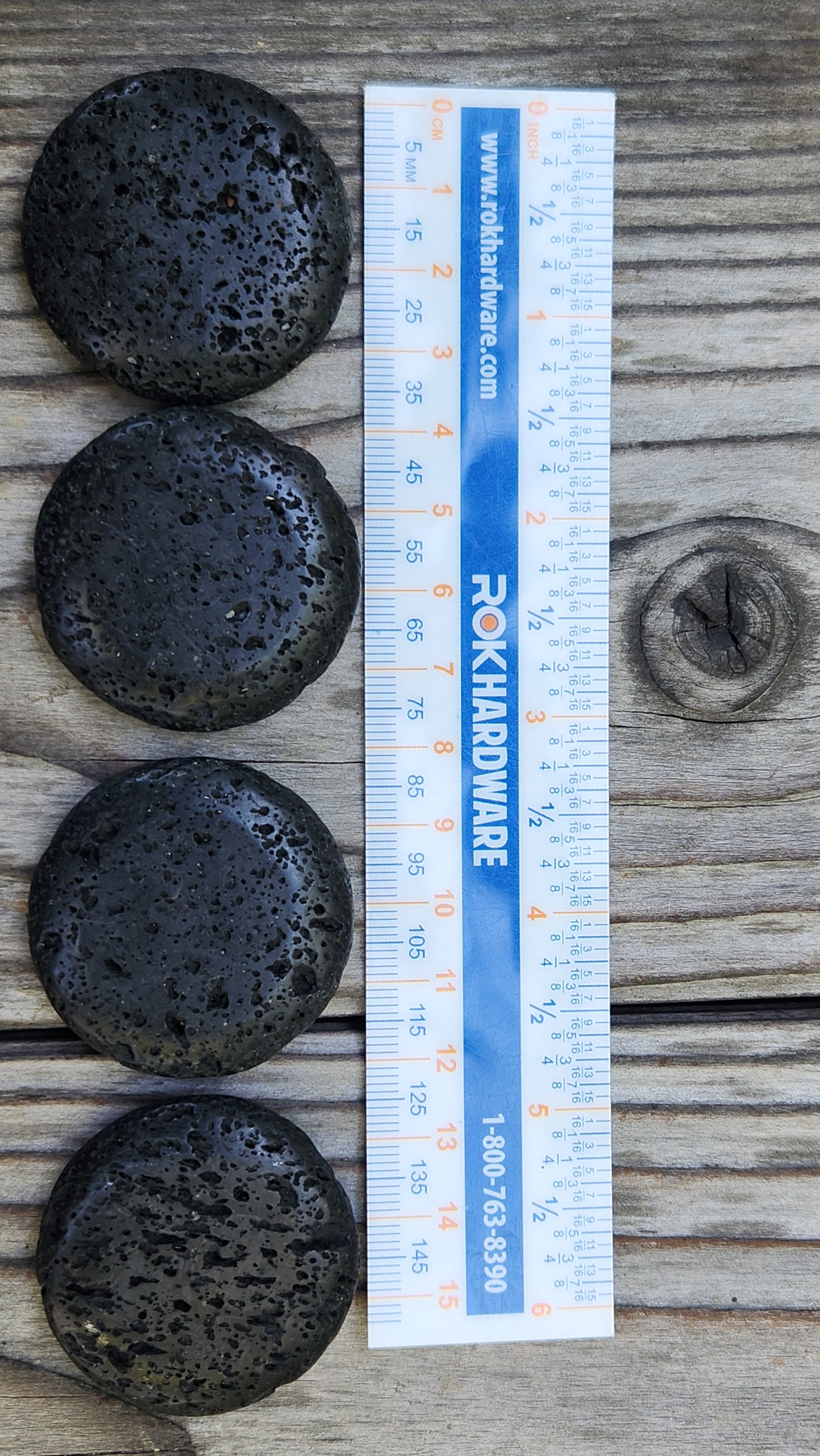Natural lava rock palm stone with volcanic texture ruler